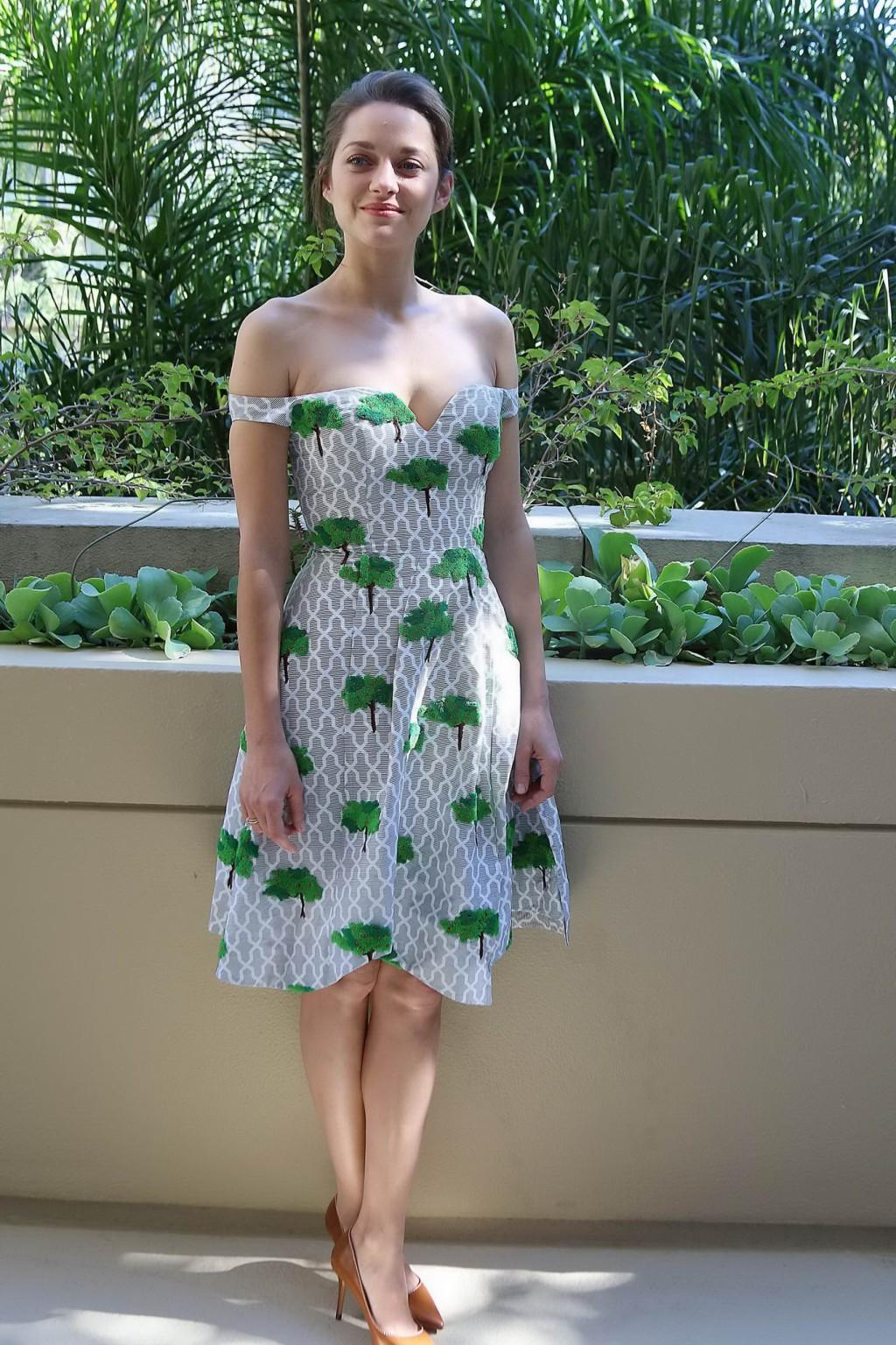 16P Marion Cotillard braless wearing sexy off shoulder dress at the Two Days One Nig
