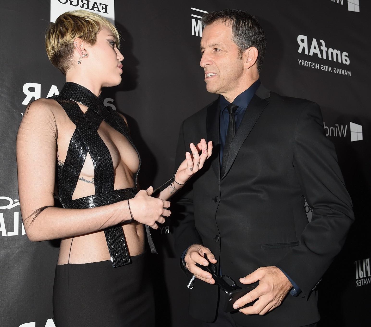 16P Miley Cyrus seethru covering only nipples at amfAR LA Inspiration 2014 Gala in H