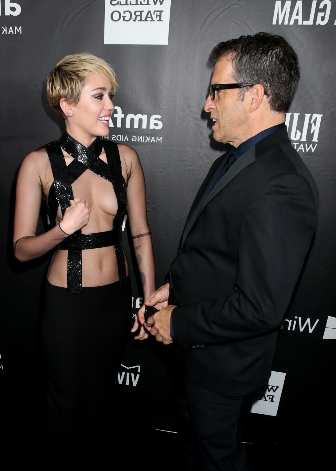 16P Miley Cyrus seethru covering only nipples at amfAR LA Inspiration 2014 Gala in H