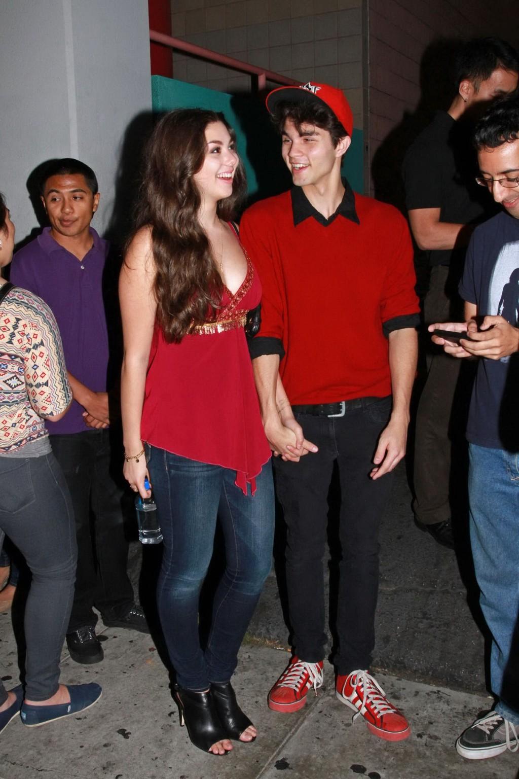 16P Kira Kosarin showing huge cleavage in a hot red top and jeans while leaving the 