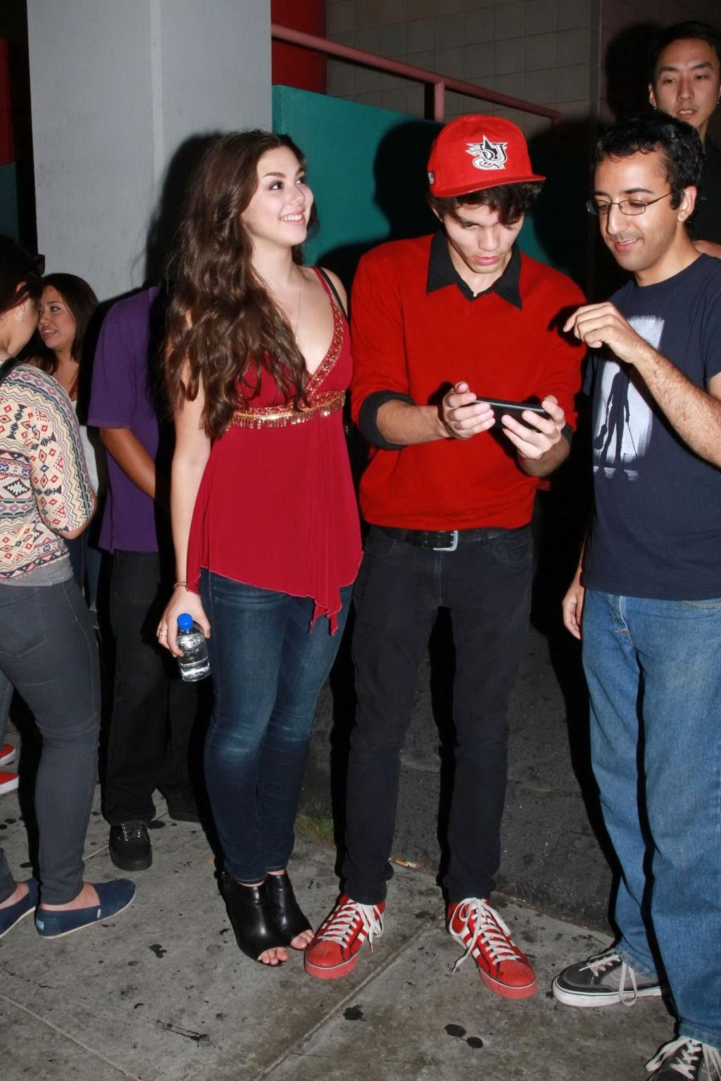 16P Kira Kosarin showing huge cleavage in a hot red top and jeans while leaving the 