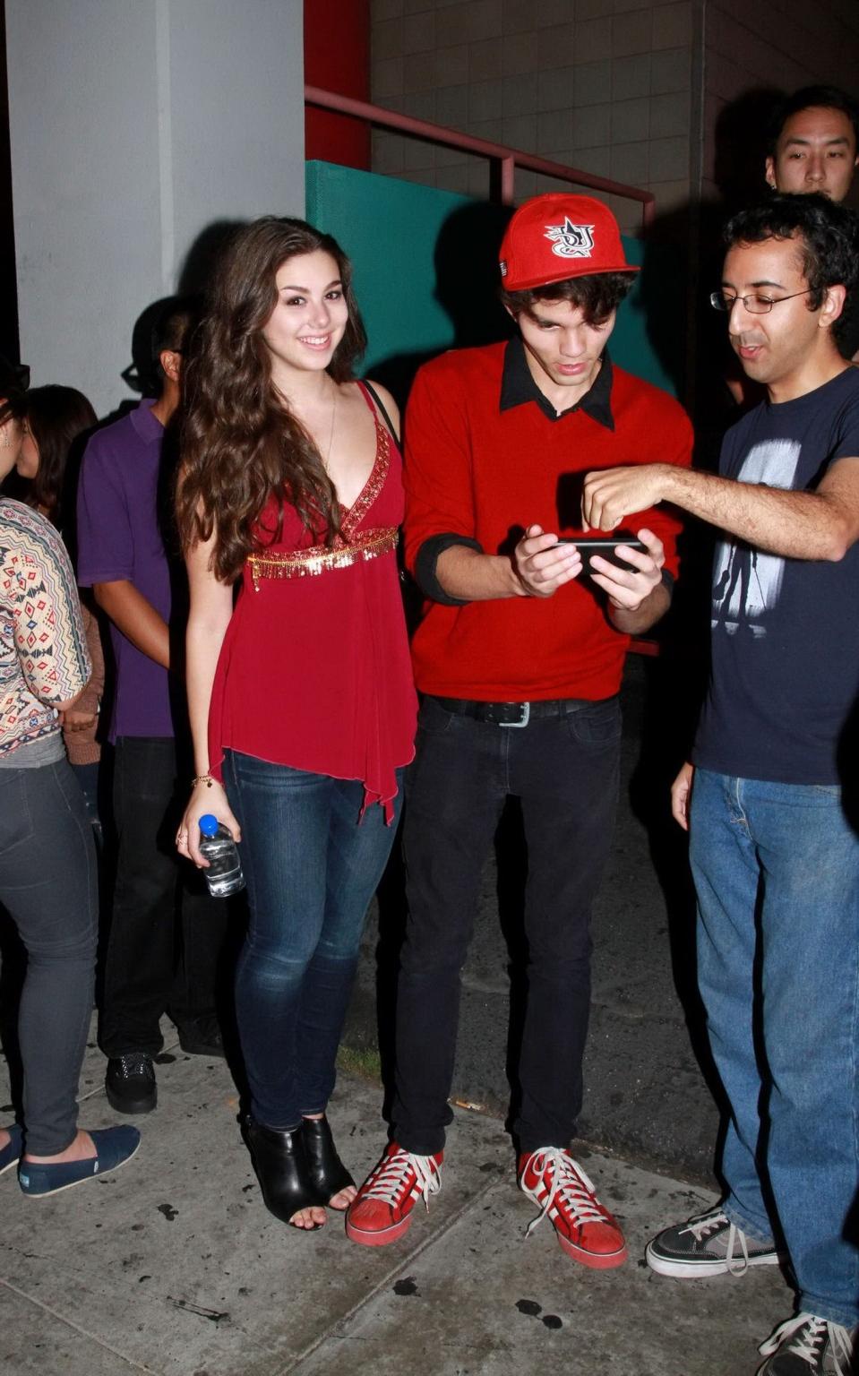 16P Kira Kosarin showing huge cleavage in a hot red top and jeans while leaving the 
