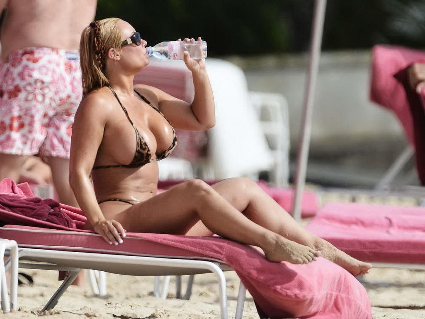 16P Nicole Coco Austin areola peek in a thong lepard print bikini at a beach in Barb