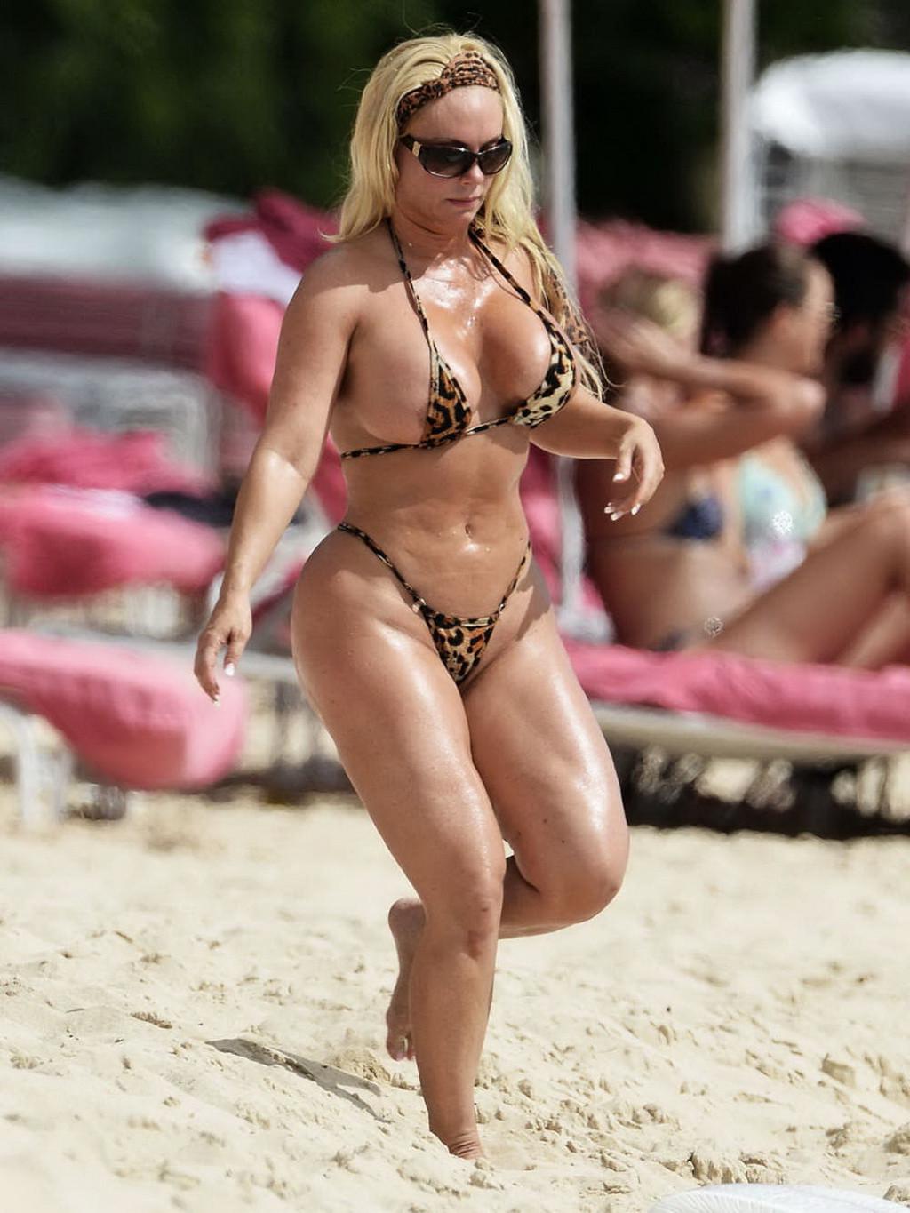16P Nicole Coco Austin areola peek in a thong lepard print bikini at a beach in Barb