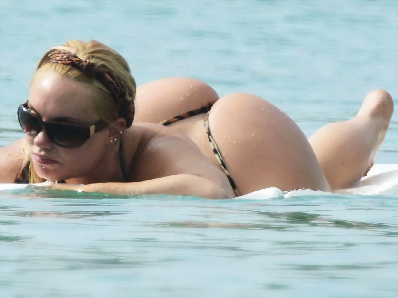 16P Nicole Coco Austin areola peek in a thong lepard print bikini at a beach in Barb