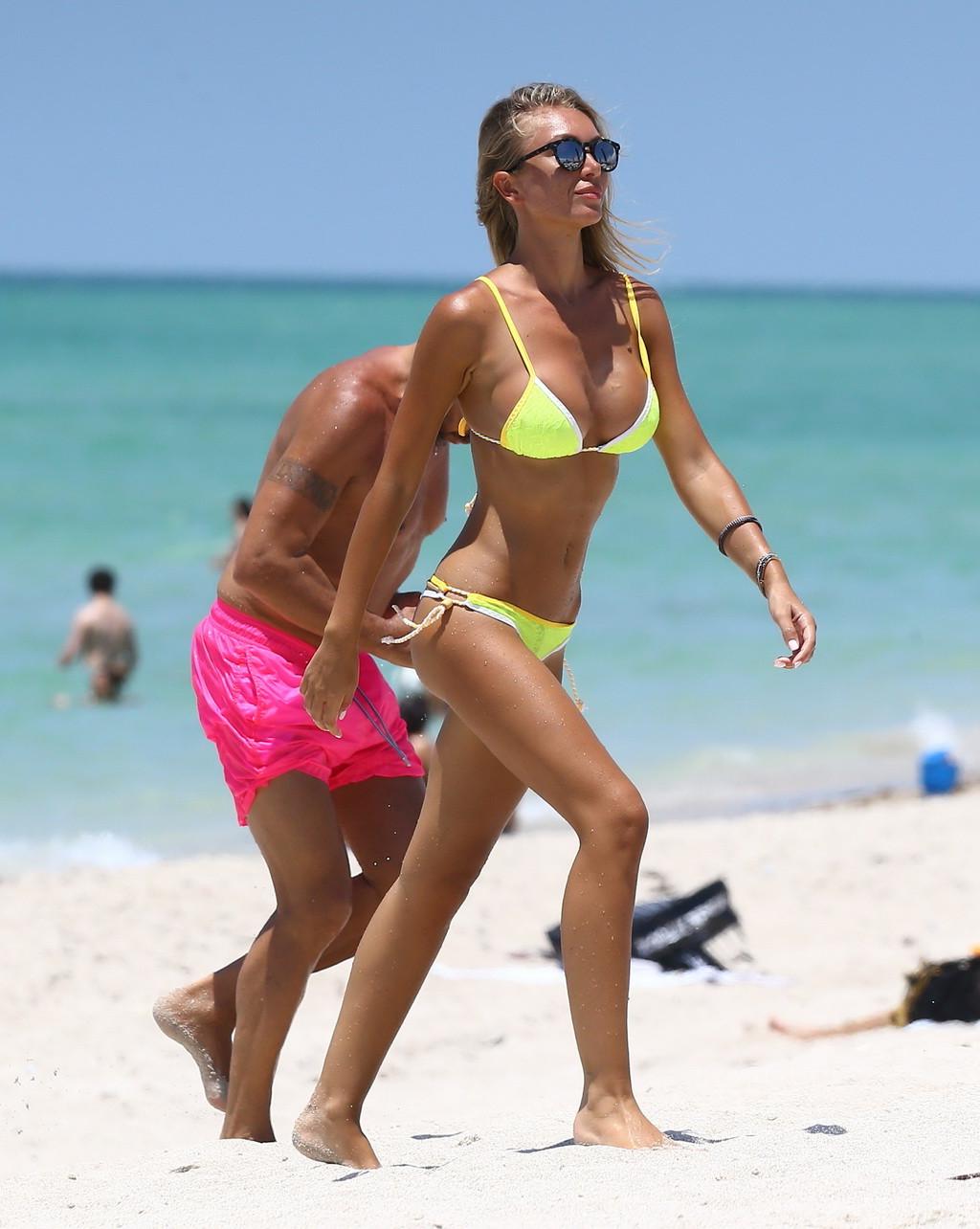 16P Laura Cremaschi topless and getting groped in a yellow thong bikini at a beach i