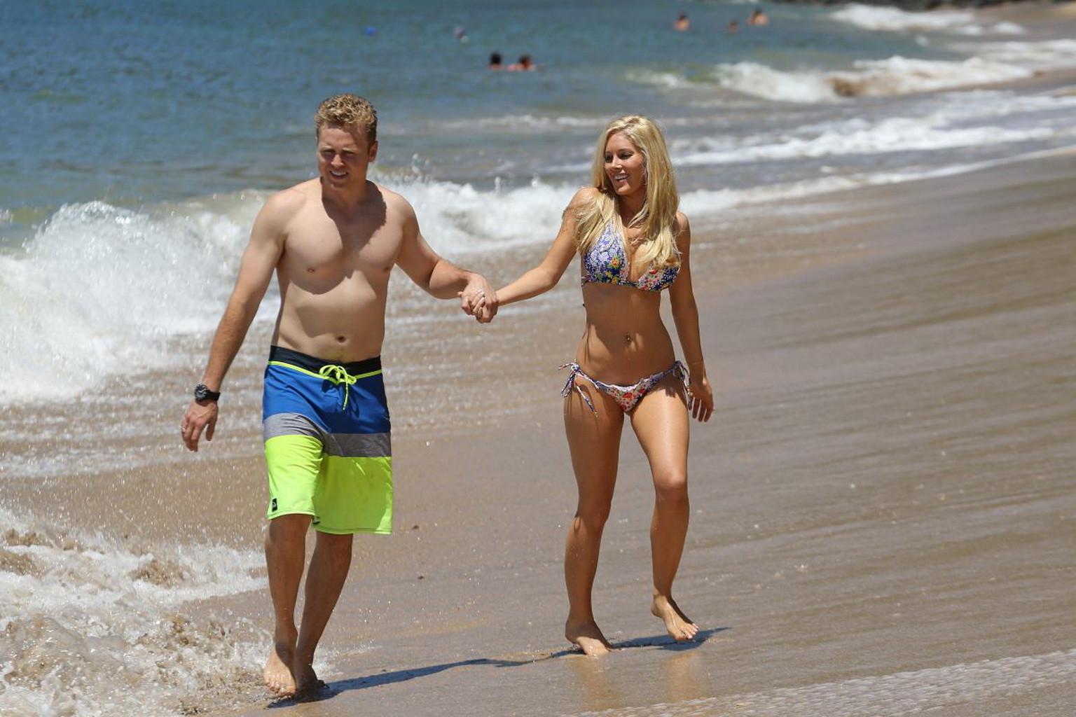 16P Heidi Montag shows off her perfect body in a colorful bikini at the beach in Haw