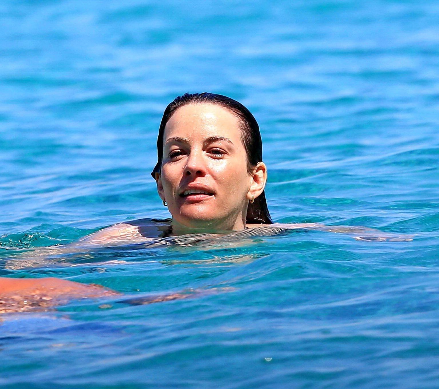 16P Liv Tyler shows off her ass wearing bikini on a yacht in Ibiza