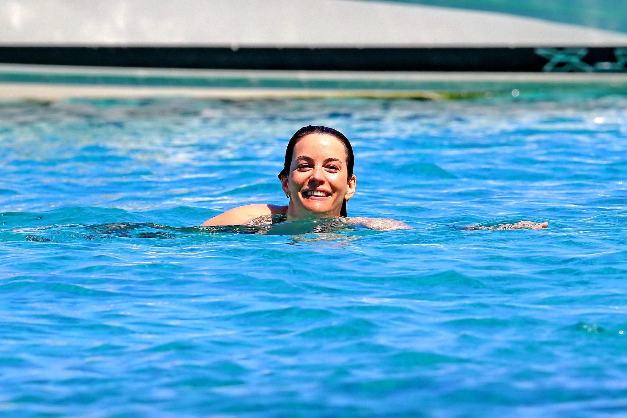 16P Liv Tyler shows off her ass wearing bikini on a yacht in Ibiza