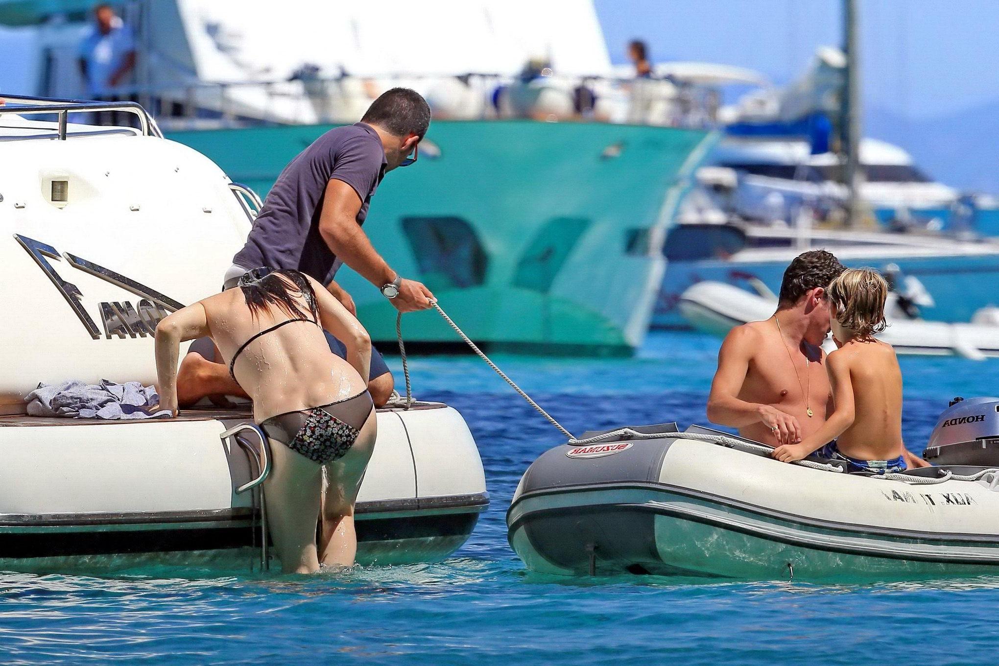 16P Liv Tyler shows off her ass wearing bikini on a yacht in Ibiza