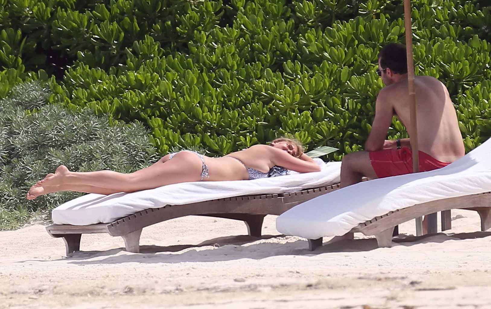 16P Kate Upton tanning her milky melons and ass in silver bikini at the beach in Mex