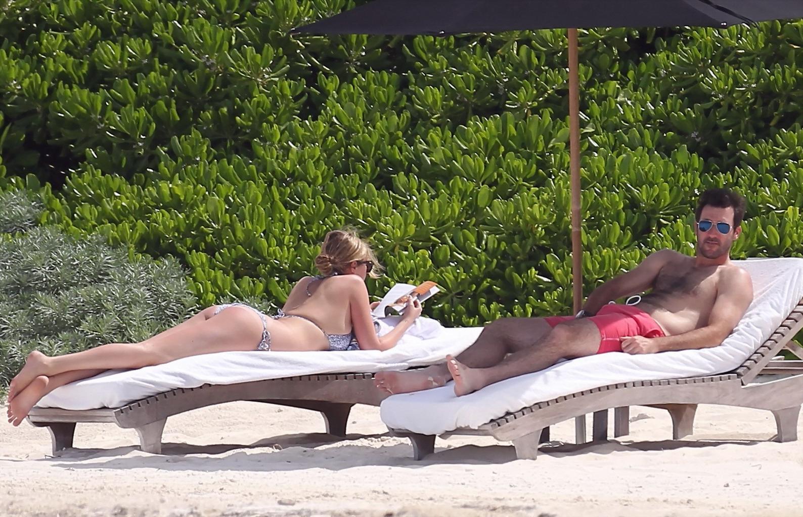 16P Kate Upton tanning her milky melons and ass in silver bikini at the beach in Mex