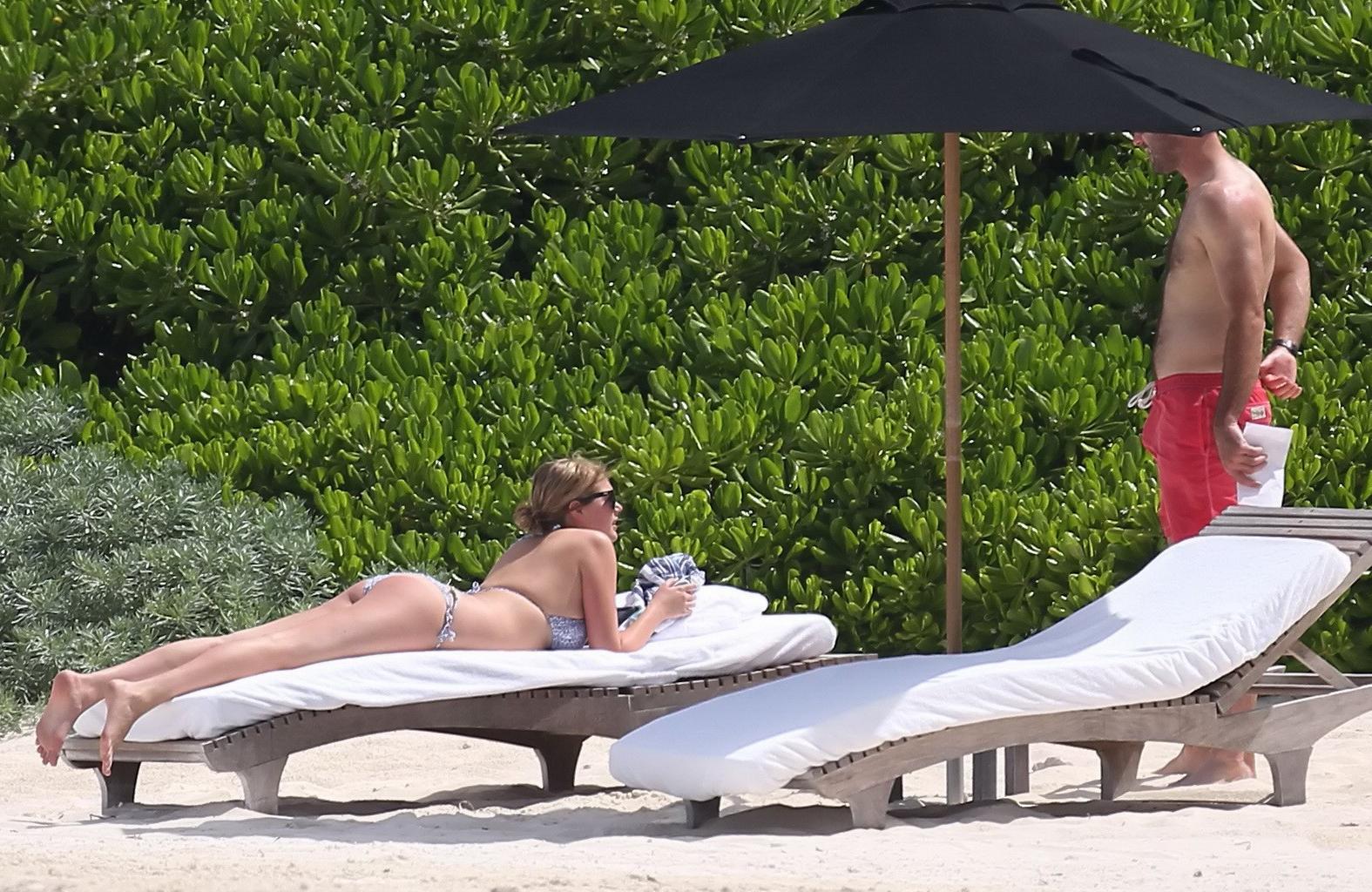 16P Kate Upton tanning her milky melons and ass in silver bikini at the beach in Mex