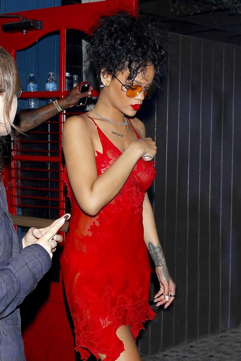 16P Rihanna shows off her boobs wearing a red see through dress at Hooray Henrys in 