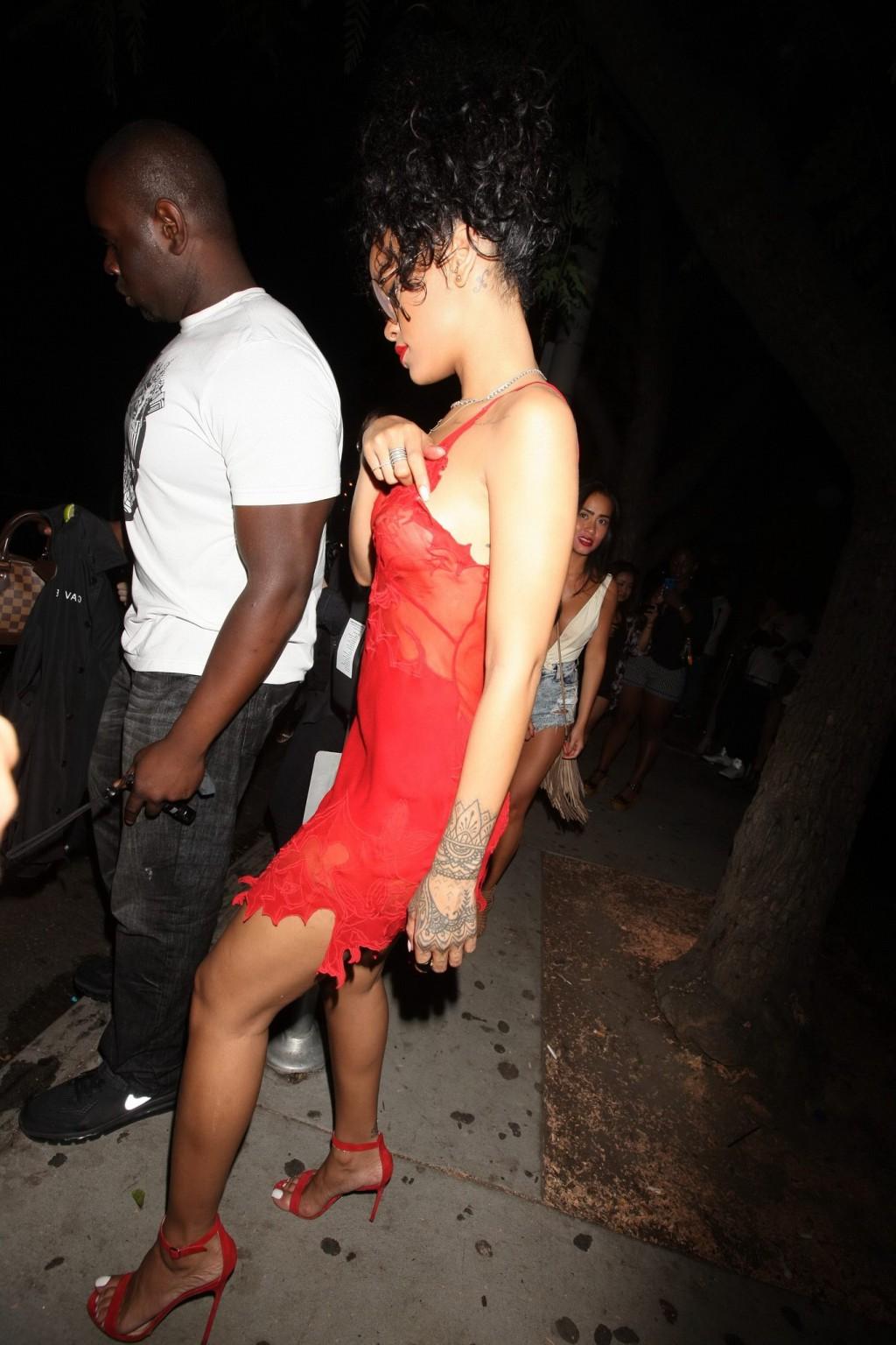 16P Rihanna shows off her boobs wearing a red see through dress at Hooray Henrys in 