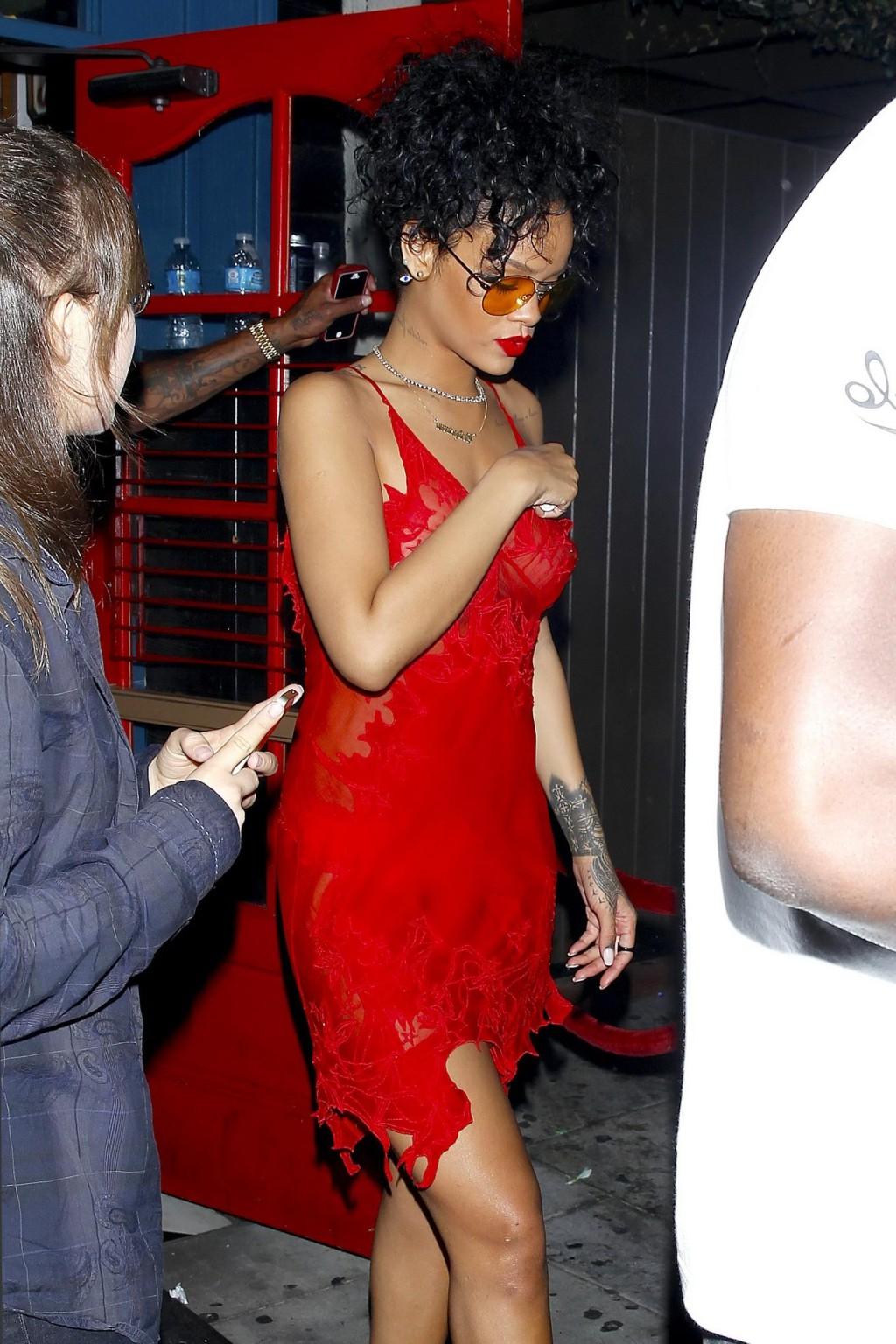 16P Rihanna shows off her boobs wearing a red see through dress at Hooray Henrys in 