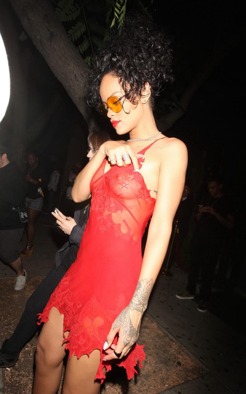 16P Rihanna shows off her boobs wearing a red see through dress at Hooray Henrys in 