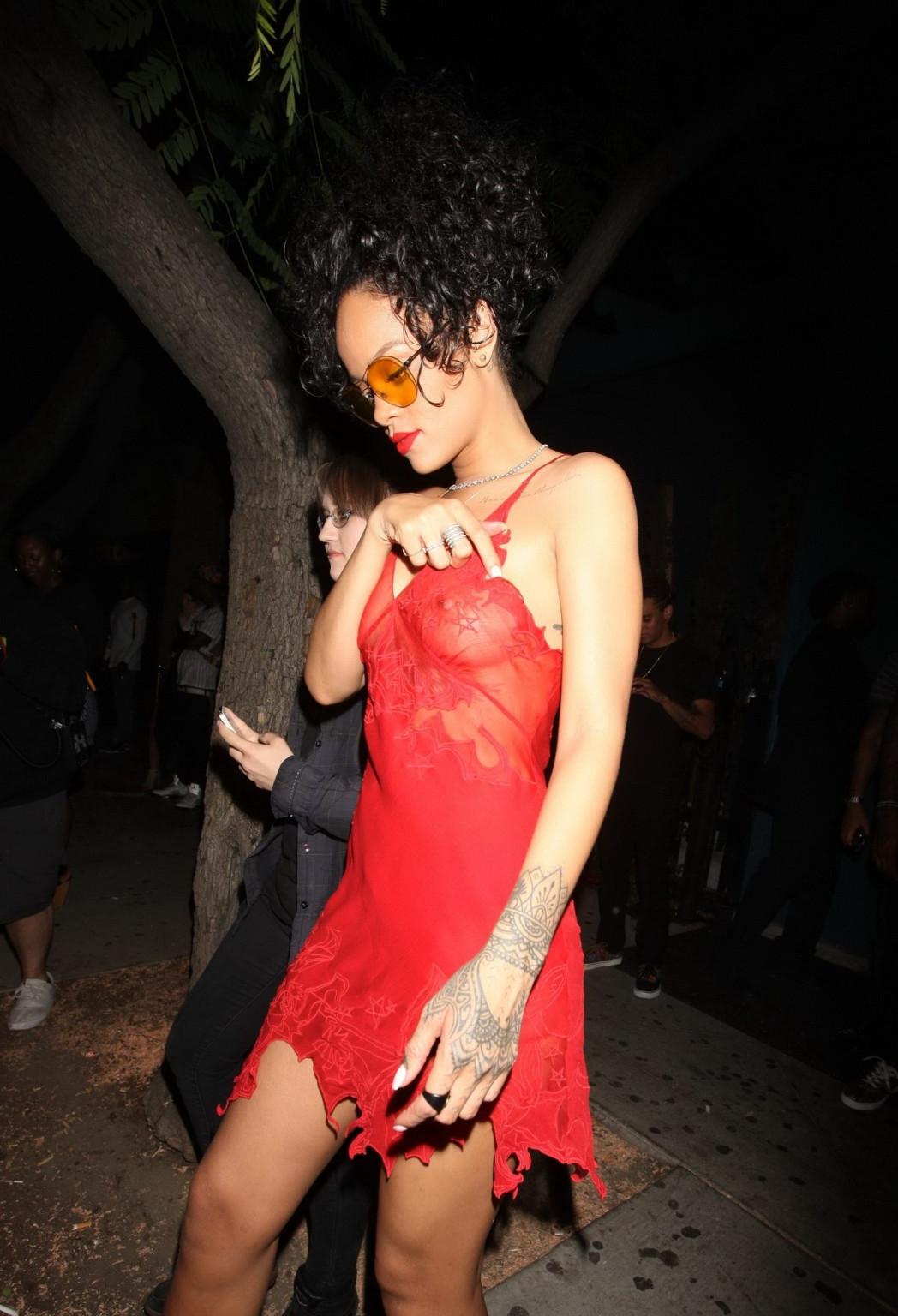 16P Rihanna shows off her boobs wearing a red see through dress at Hooray Henrys in 