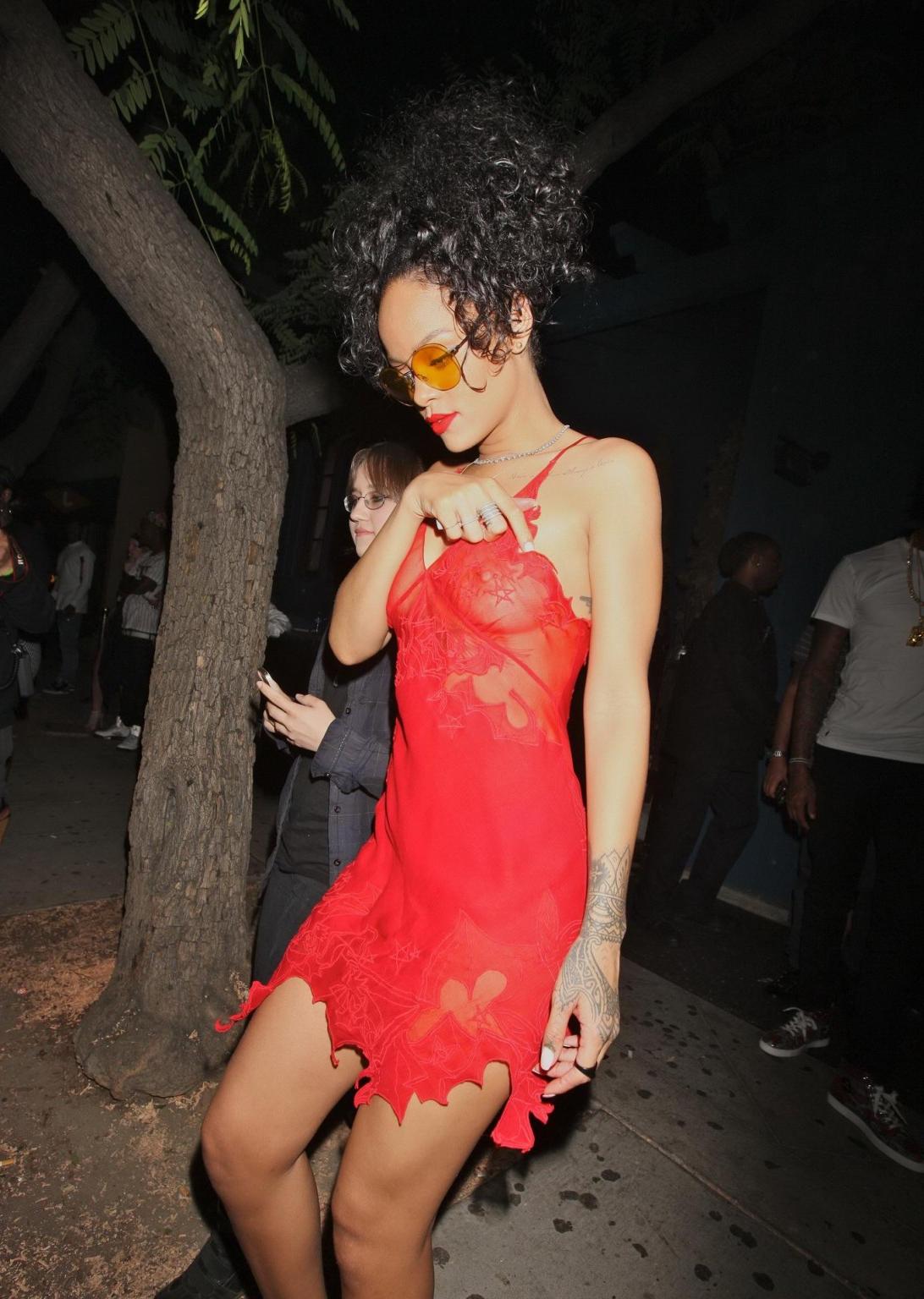16P Rihanna shows off her boobs wearing a red see through dress at Hooray Henrys in 
