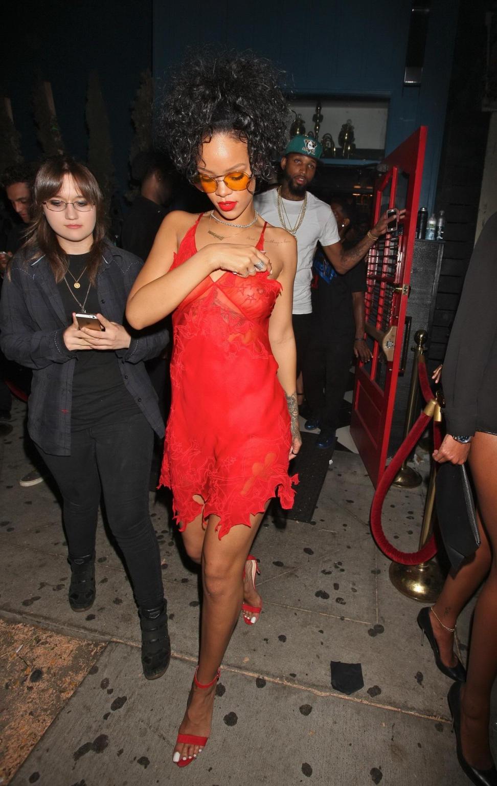 16P Rihanna shows off her boobs wearing a red see through dress at Hooray Henrys in 