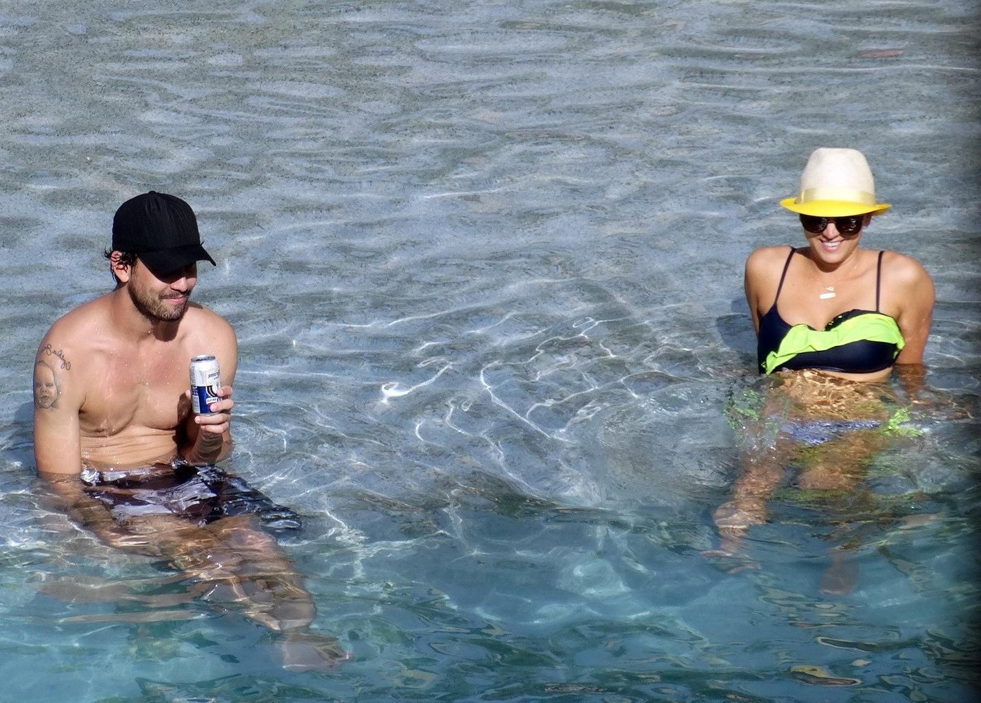 16P Kaley Cuoco busty wearing skimpy twopiece with her husband at the pool in Mexico