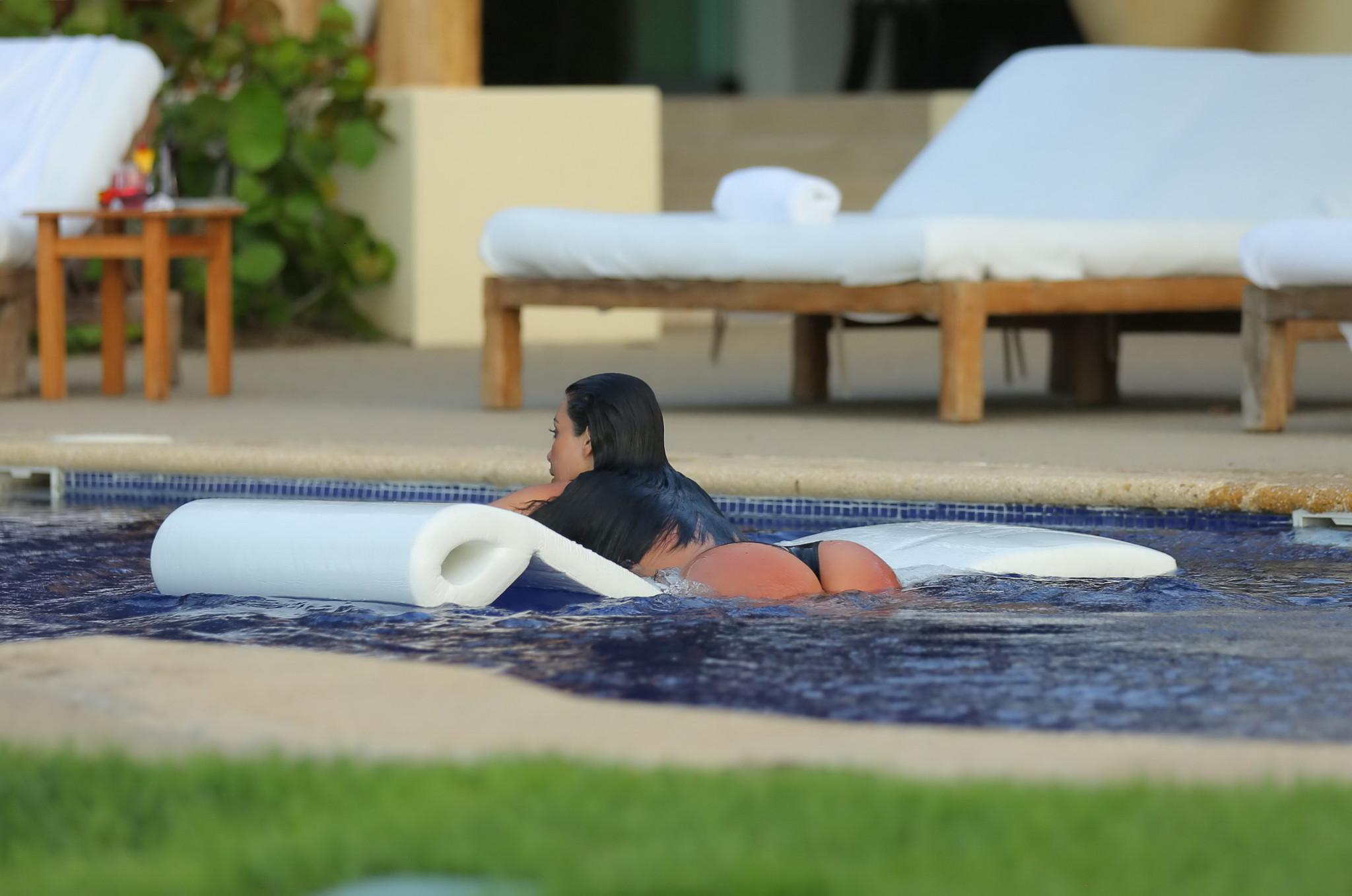 16P Kim Kardashian shows off her huge boobs in a wet seethru top poolside in Mexico
