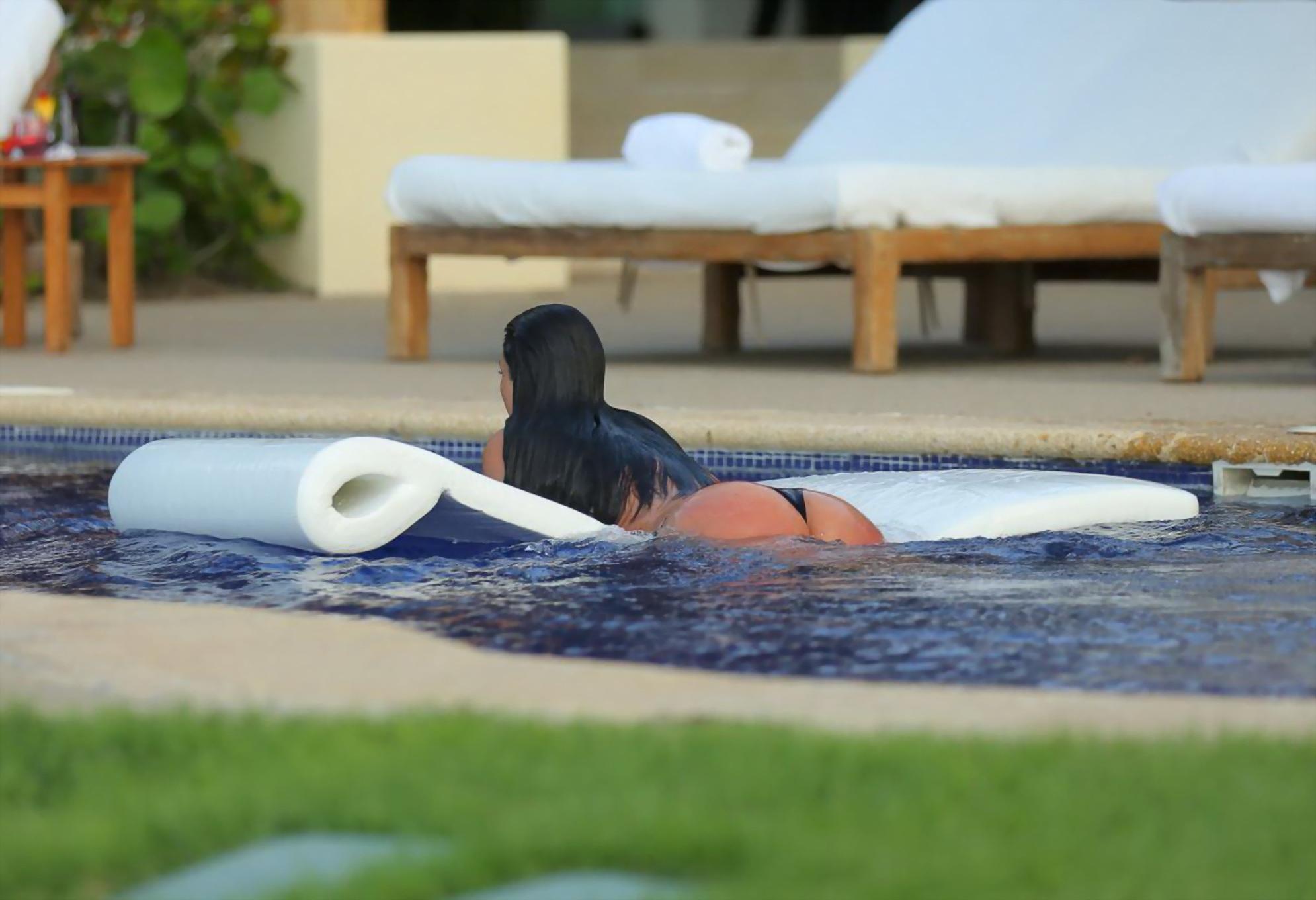 16P Kim Kardashian shows off her huge boobs in a wet seethru top poolside in Mexico