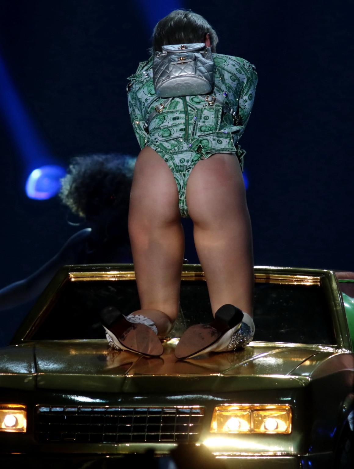 16P Miley Cyrus shows off her ass in money inspired leotard while performing at Bang