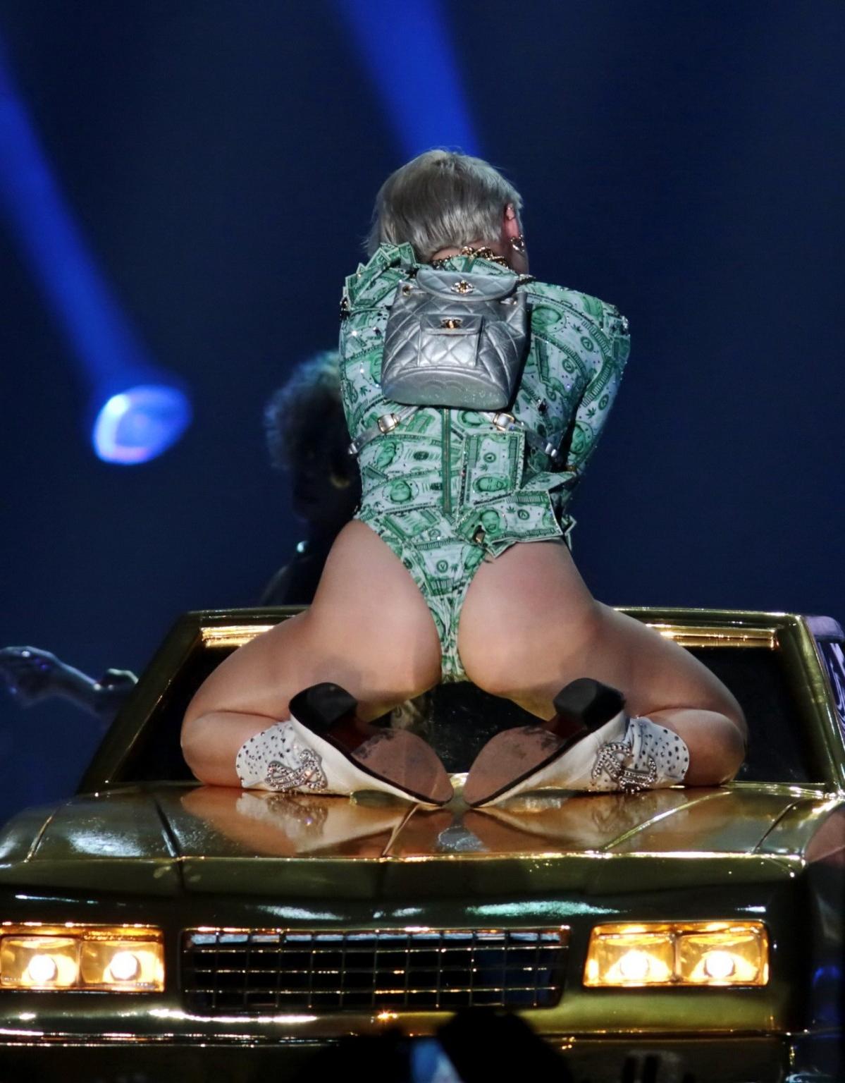 16P Miley Cyrus shows off her ass in money inspired leotard while performing at Bang