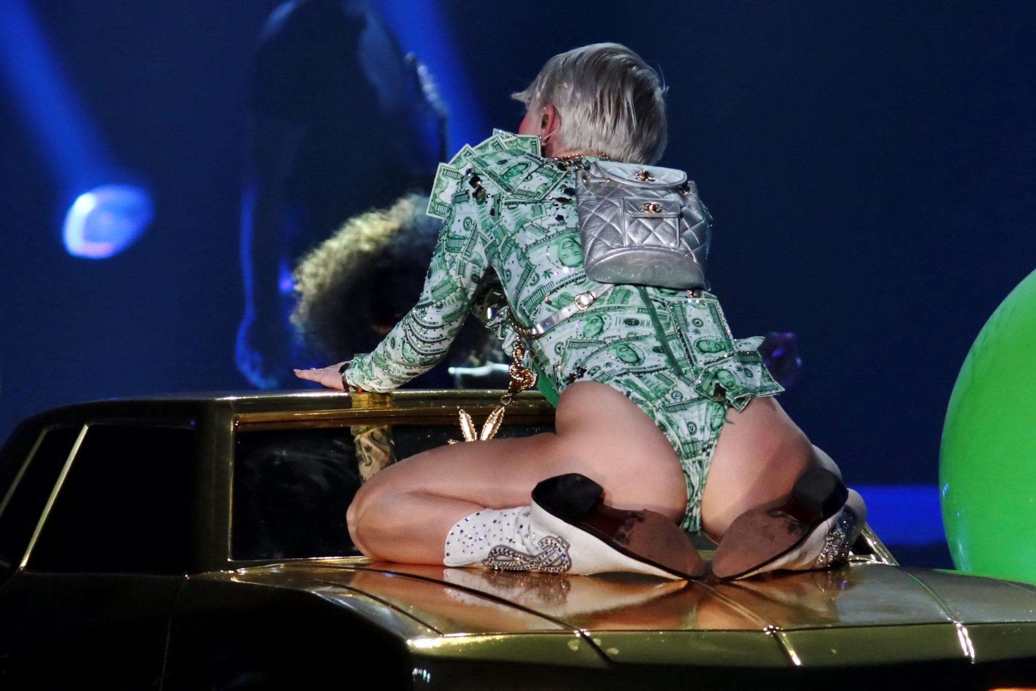16P Miley Cyrus shows off her ass in money inspired leotard while performing at Bang