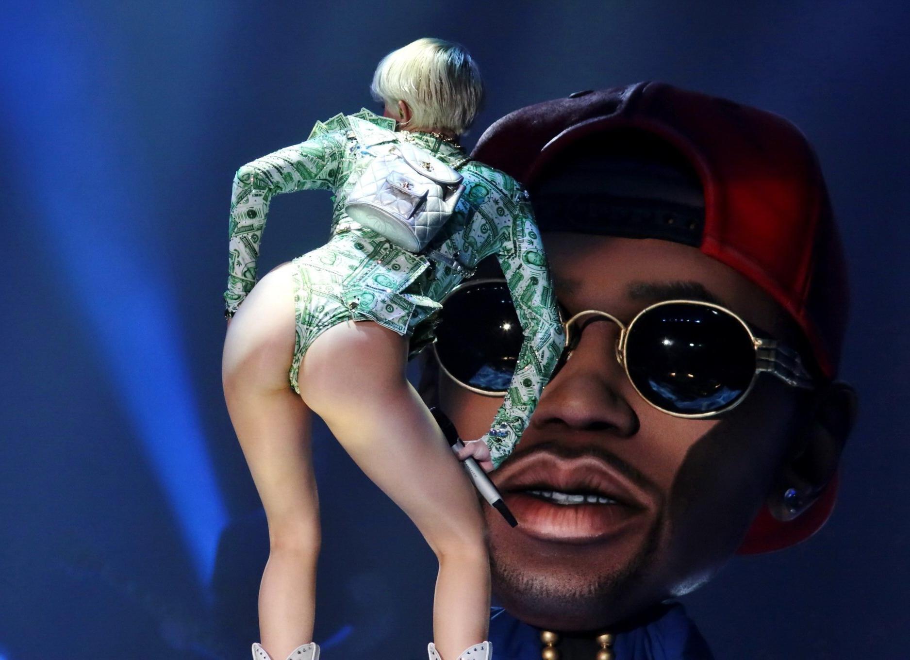 16P Miley Cyrus shows off her ass in money inspired leotard while performing at Bang