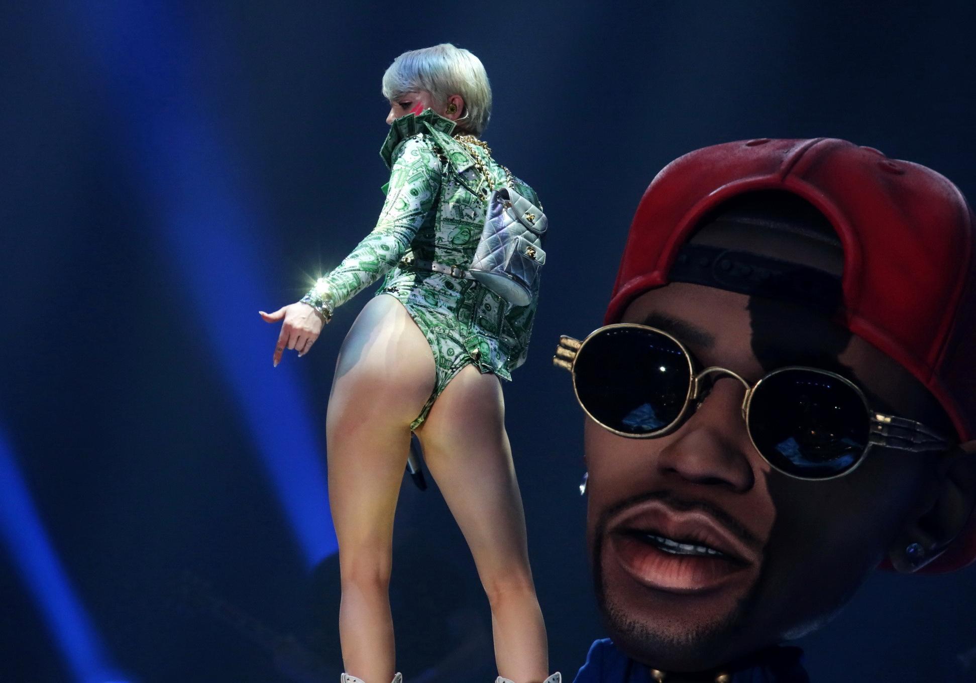 16P Miley Cyrus shows off her ass in money inspired leotard while performing at Bang