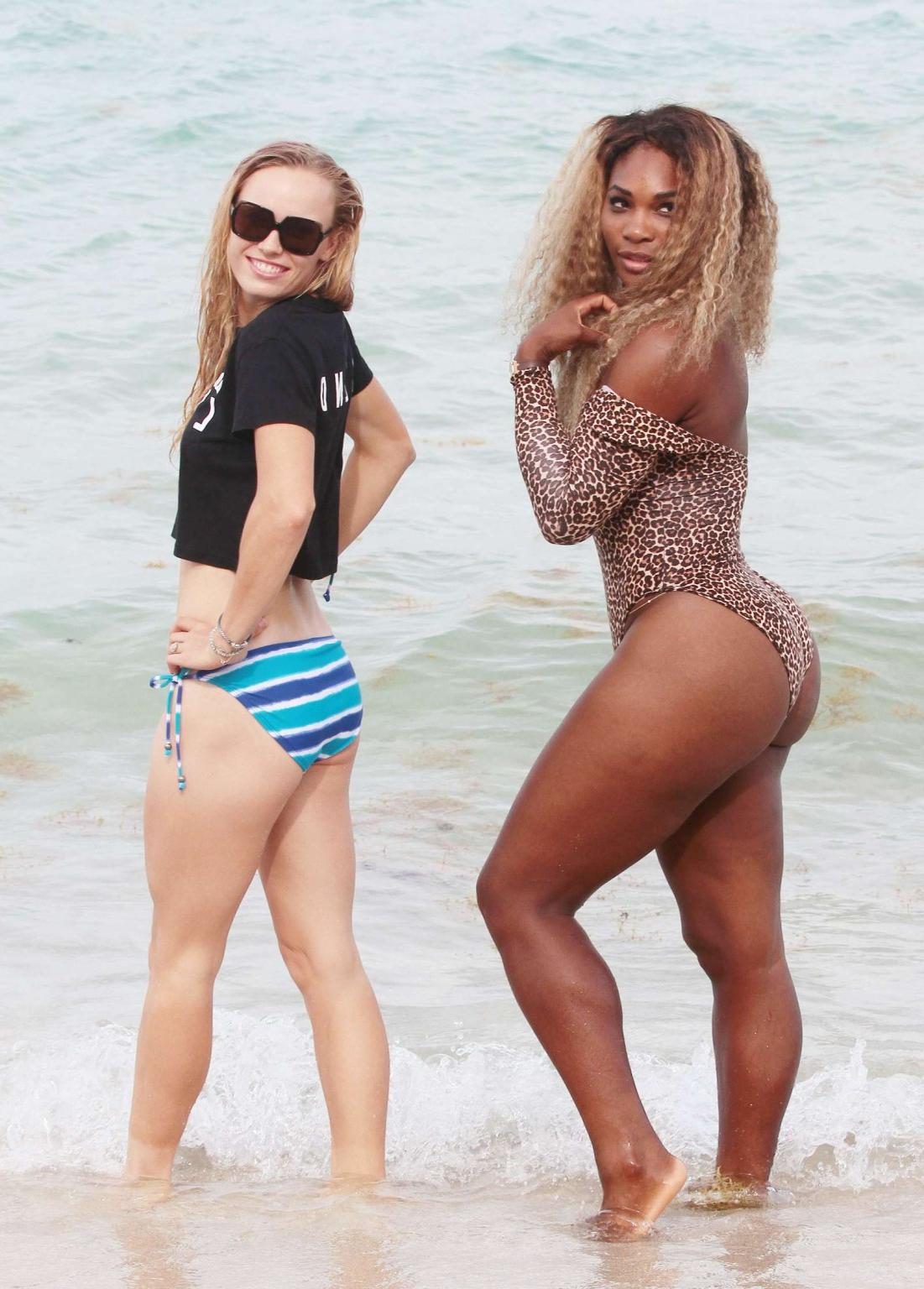 16P Serena Williams shows off her curvy body wearing a leopard print swimsuit on a b
