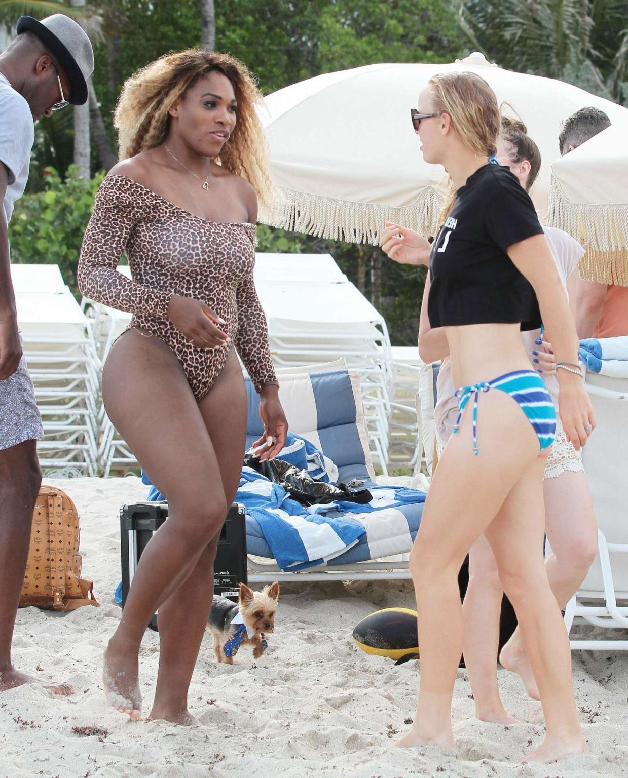 16P Serena Williams shows off her curvy body wearing a leopard print swimsuit on a b