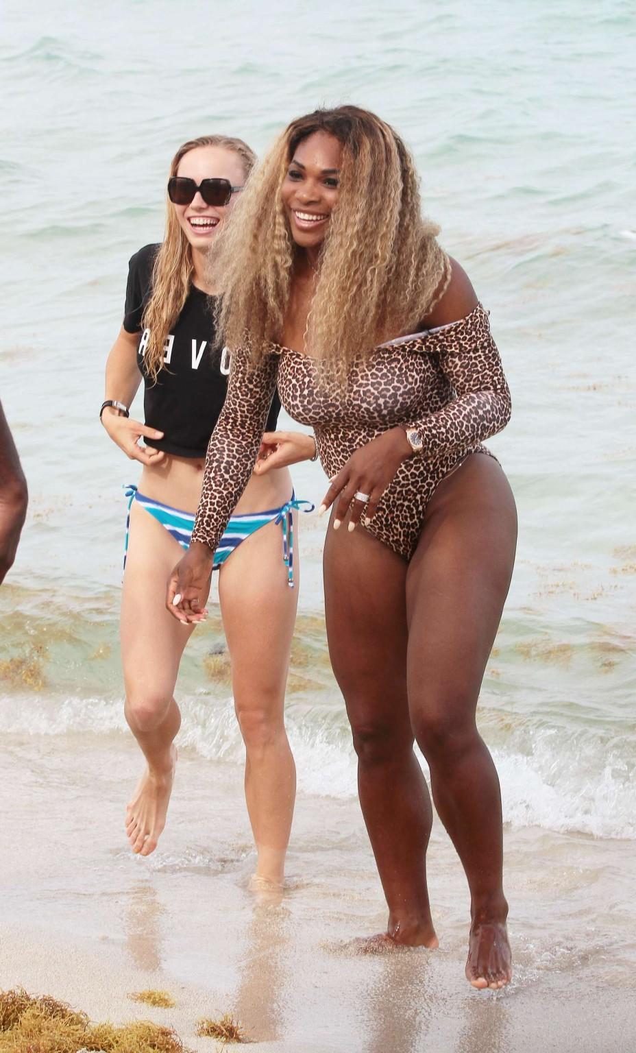 16P Serena Williams shows off her curvy body wearing a leopard print swimsuit on a b