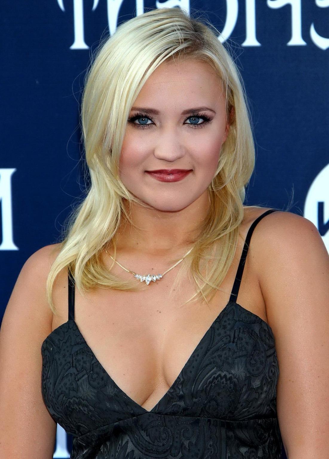 16P Busty Emily Osment wearing a low cut black dress at the Maleficent premiere in H