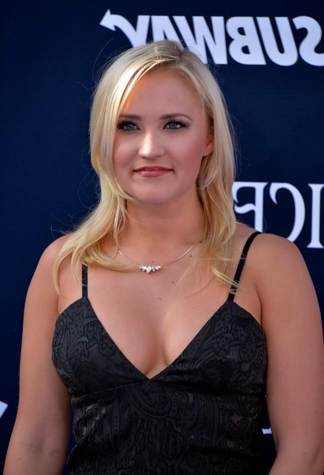 16P Busty Emily Osment wearing a low cut black dress at the Maleficent premiere in H