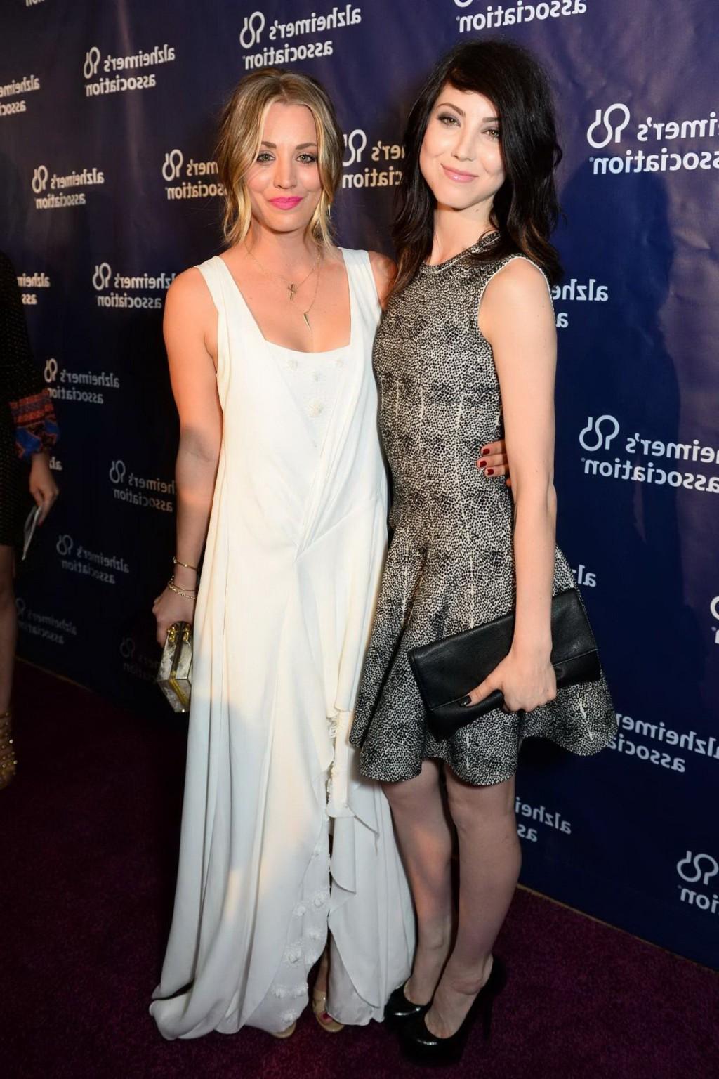 16P Kaley Cuoco showing big cleavage in white maxi dress