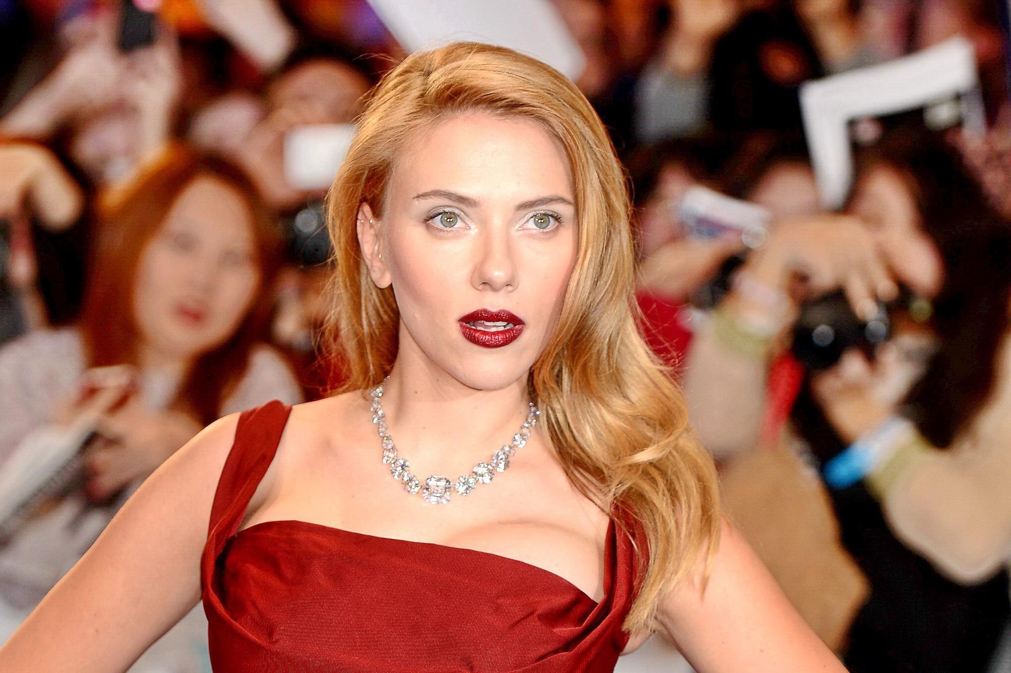16P Scarlett Johansson busty wearing a low cut dress at the 'Captain America: The Wi