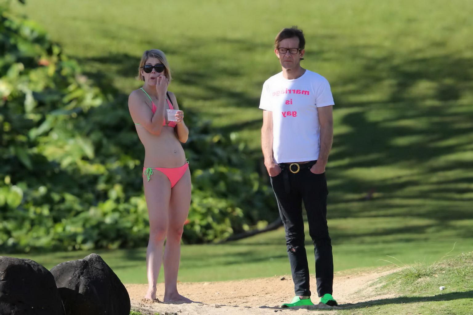 16P Rosamund Pike wearing tiny pink bikini at the beach in Hawaii