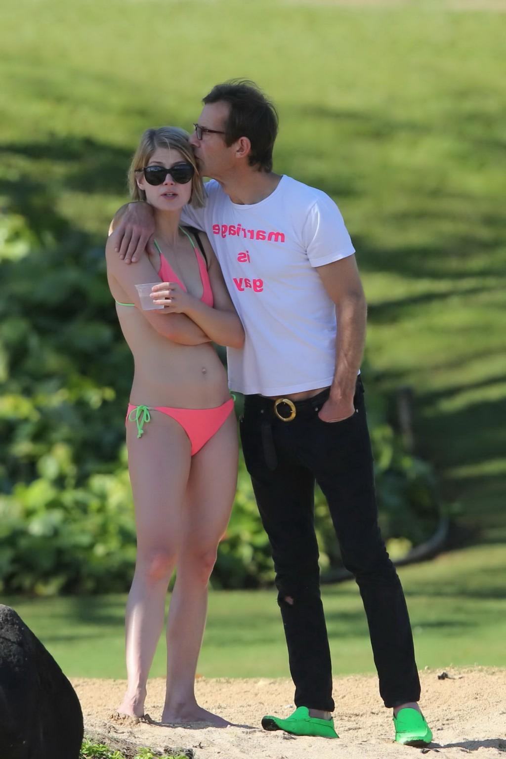 16P Rosamund Pike wearing tiny pink bikini at the beach in Hawaii