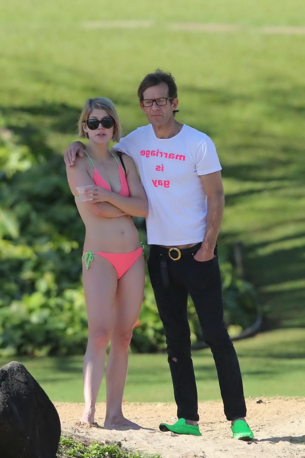 16P Rosamund Pike wearing tiny pink bikini at the beach in Hawaii