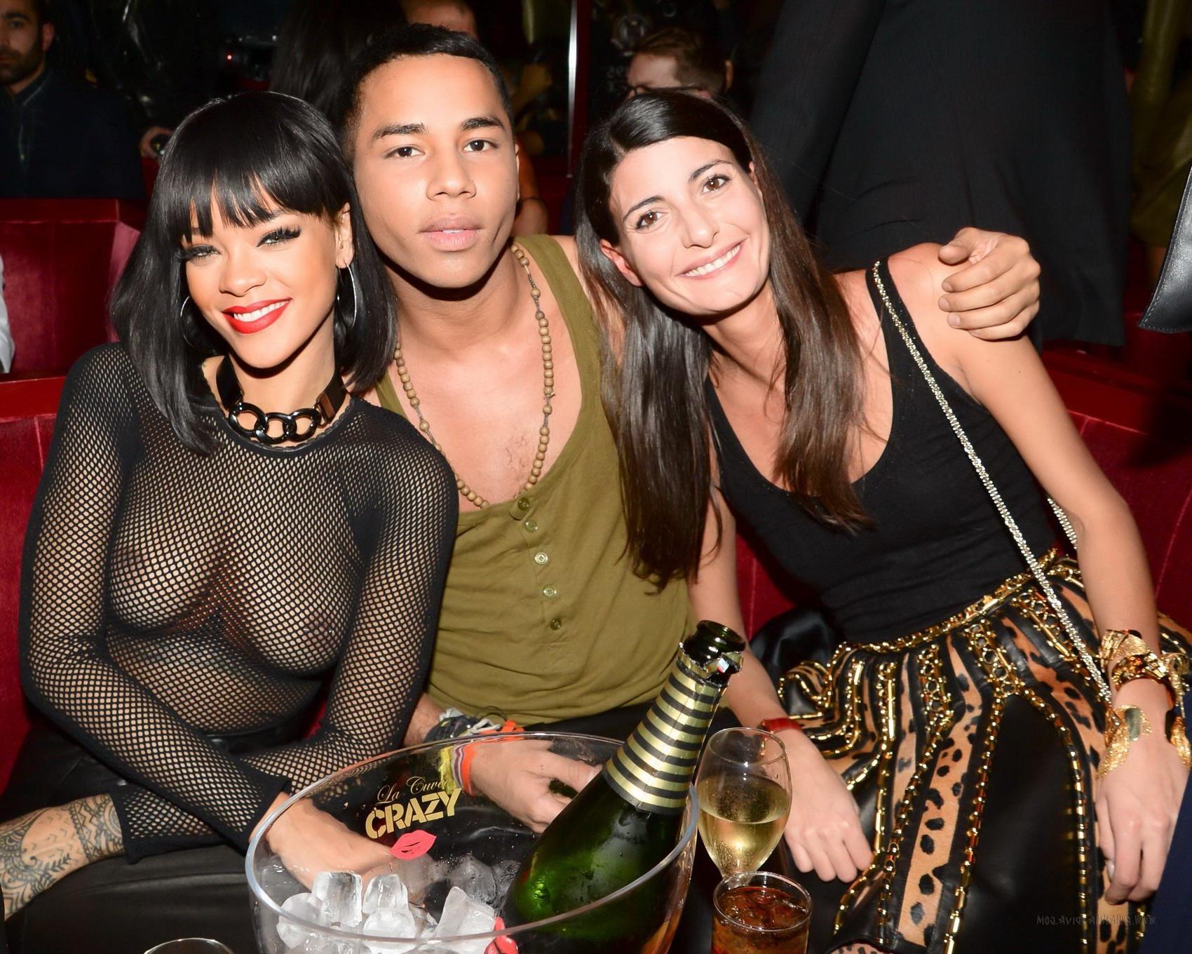 16P Rihanna braless wearing fishnet bodysuit and leather outfit at the Balmain Fashi