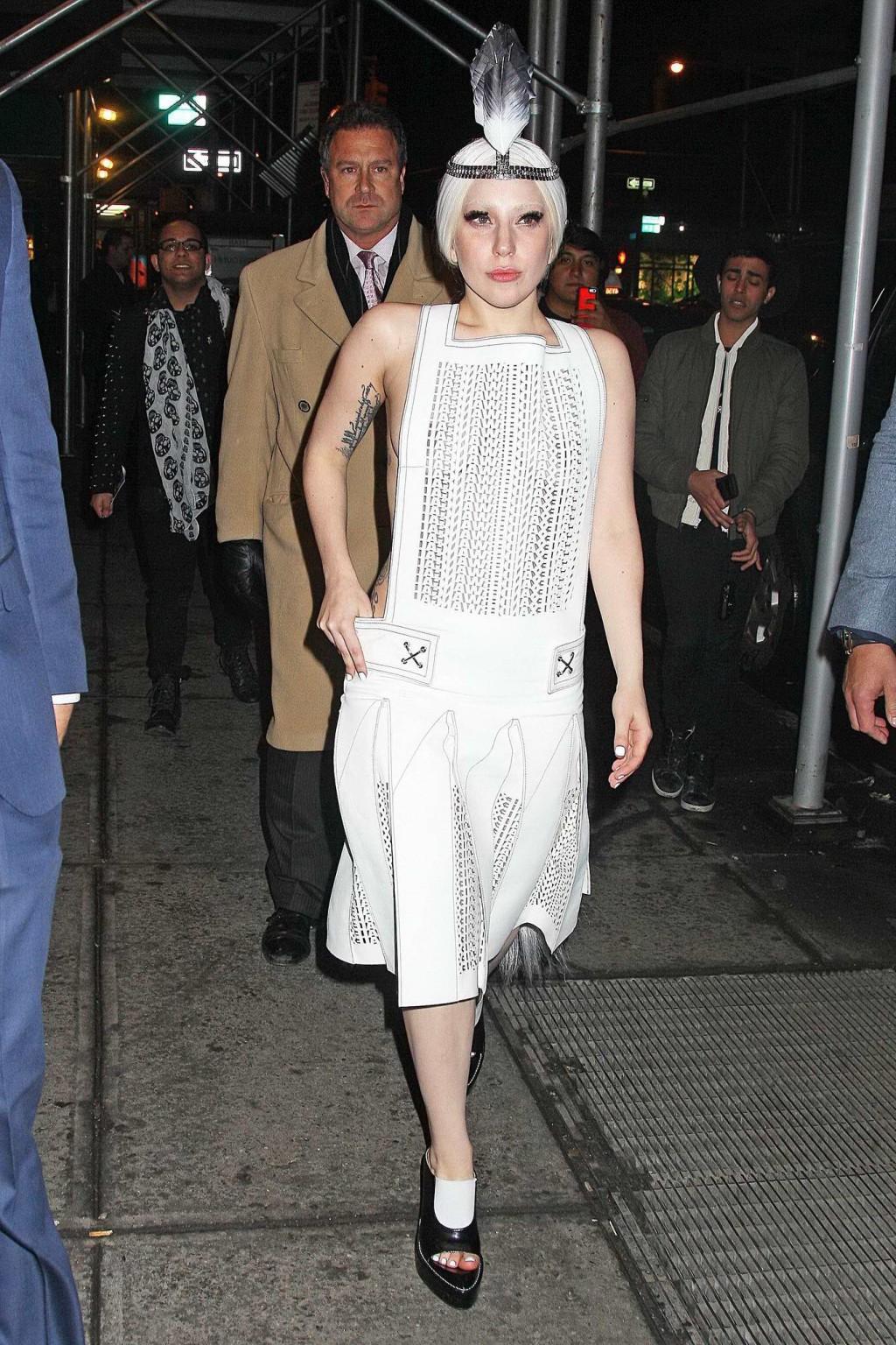 16P Lady Gaga shows off her boobs in a see-through leather dress while arriving to t