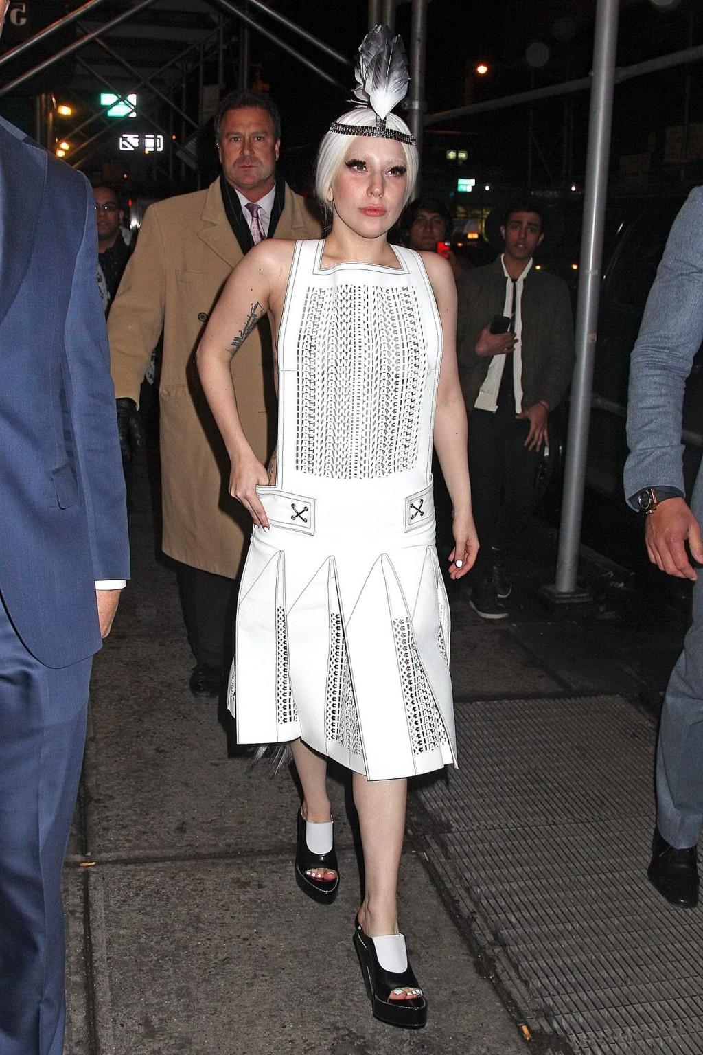 16P Lady Gaga shows off her boobs in a see-through leather dress while arriving to t