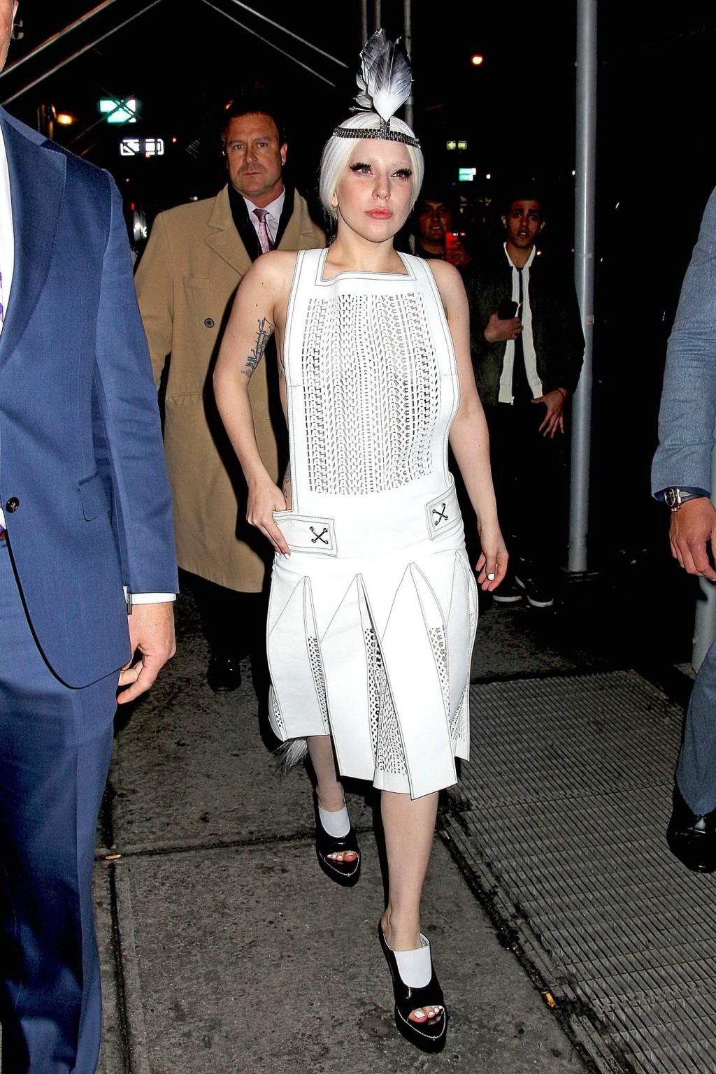 16P Lady Gaga shows off her boobs in a see-through leather dress while arriving to t