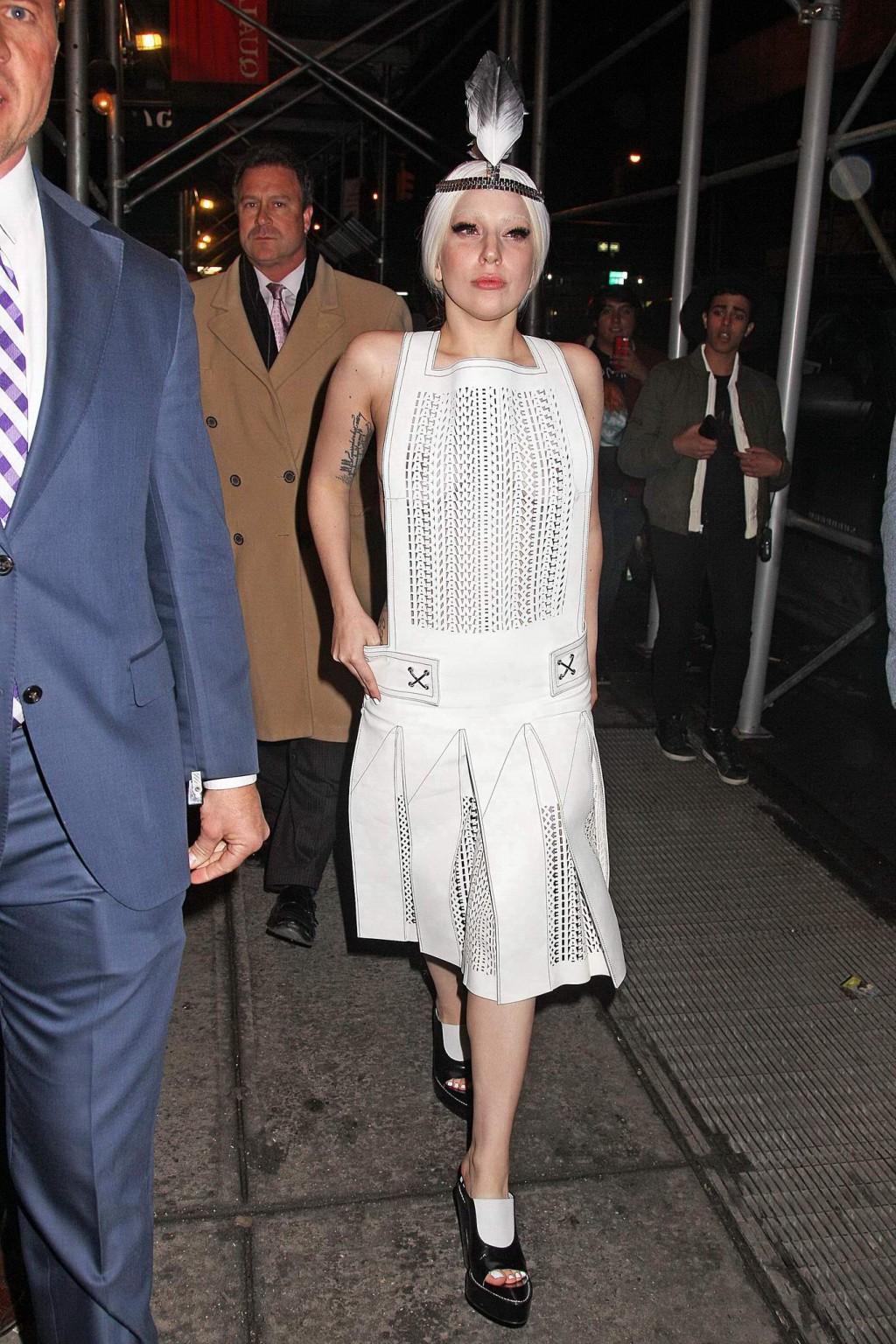 16P Lady Gaga shows off her boobs in a see-through leather dress while arriving to t