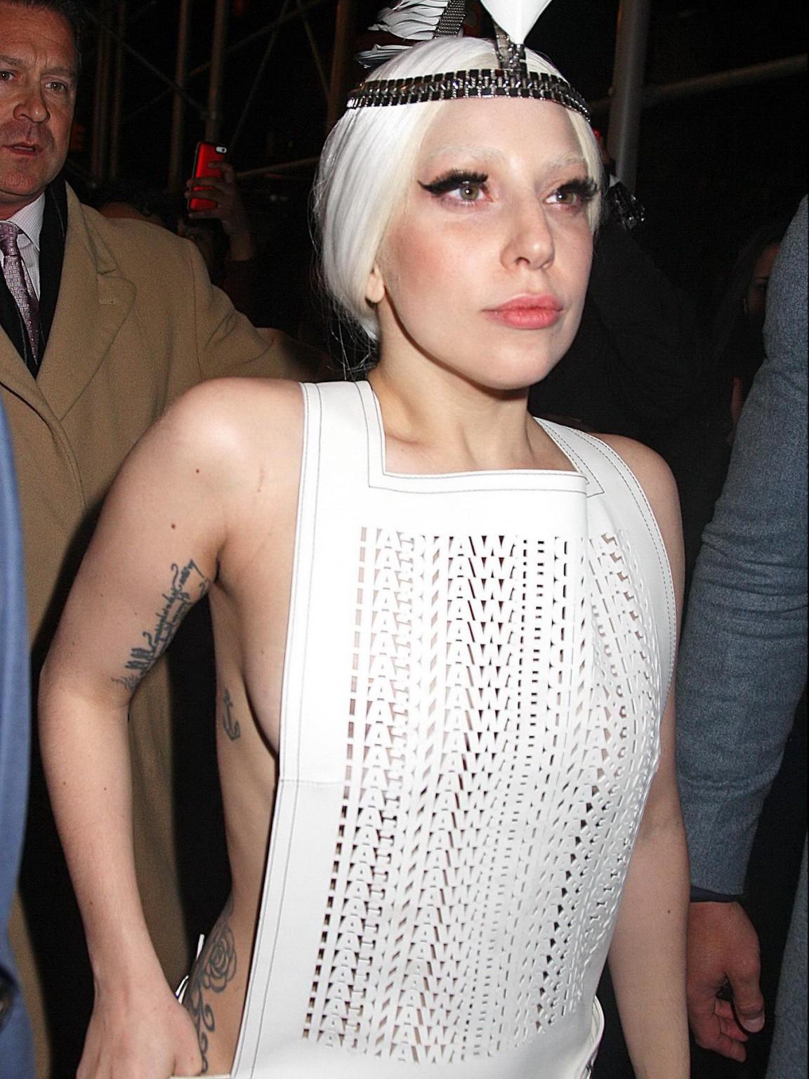 16P Lady Gaga shows off her boobs in a see-through leather dress while arriving to t