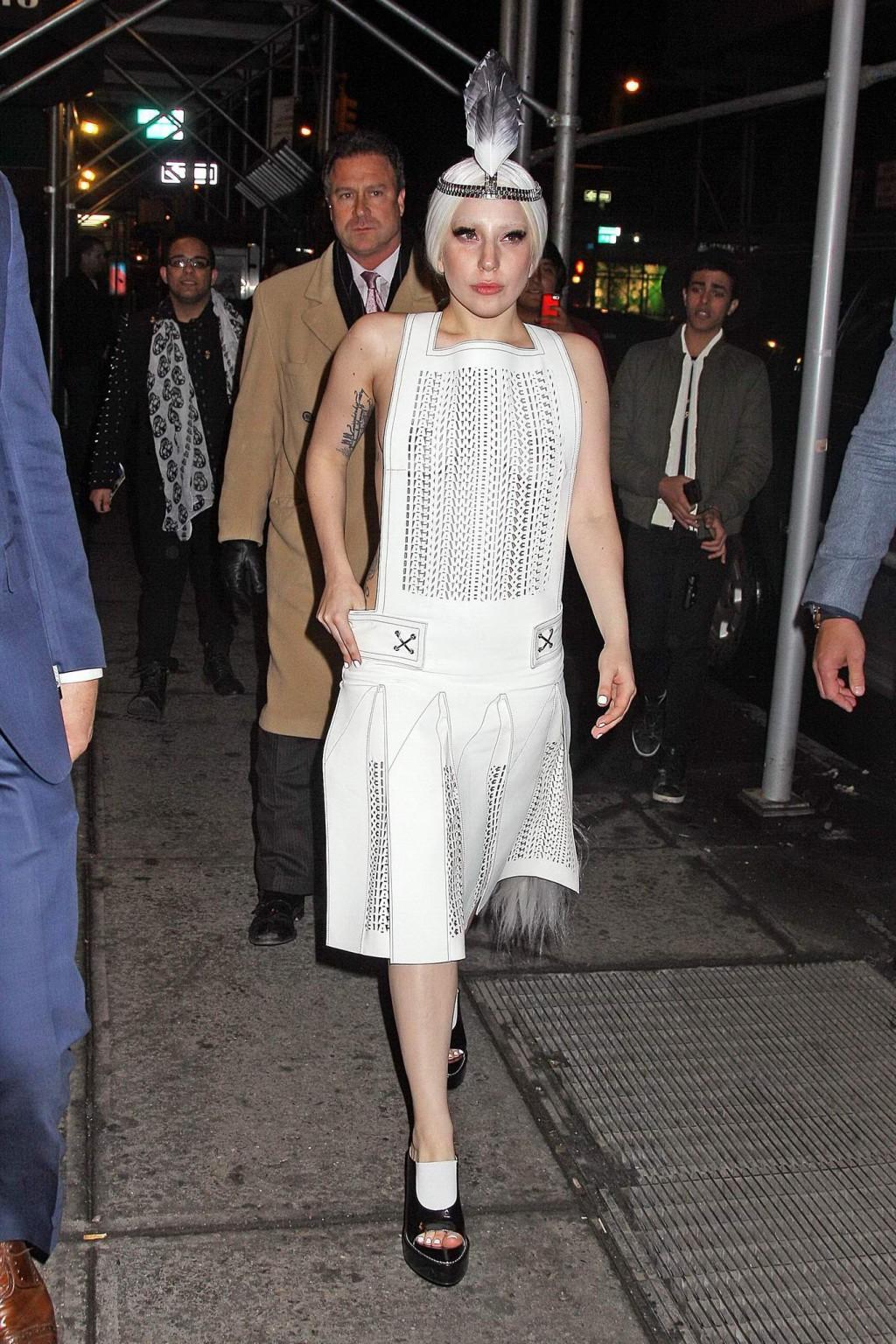 16P Lady Gaga shows off her boobs in a see-through leather dress while arriving to t