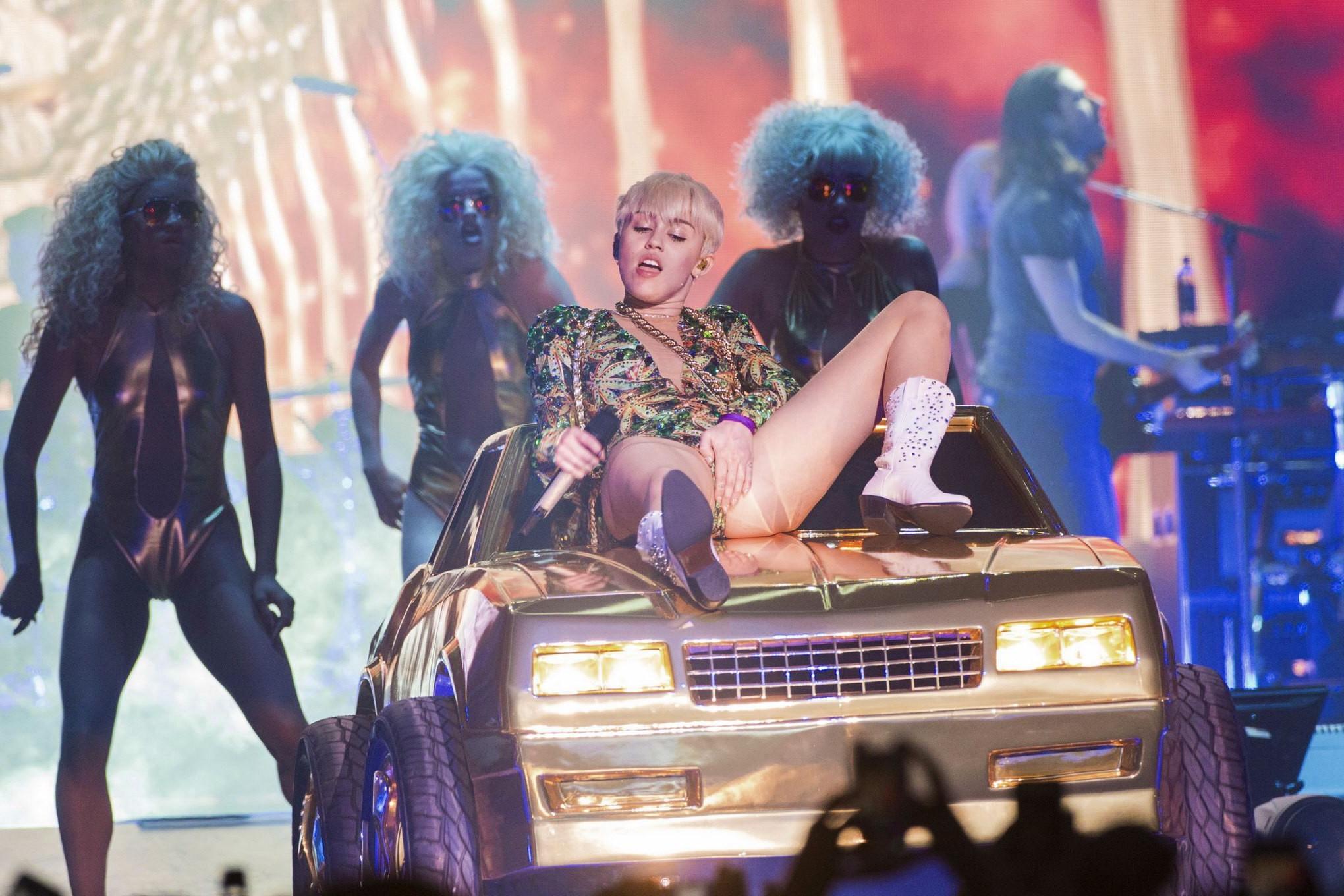 16P Miley Cyrus naughty performance in marijuana leaf print bodysuit during the Bang